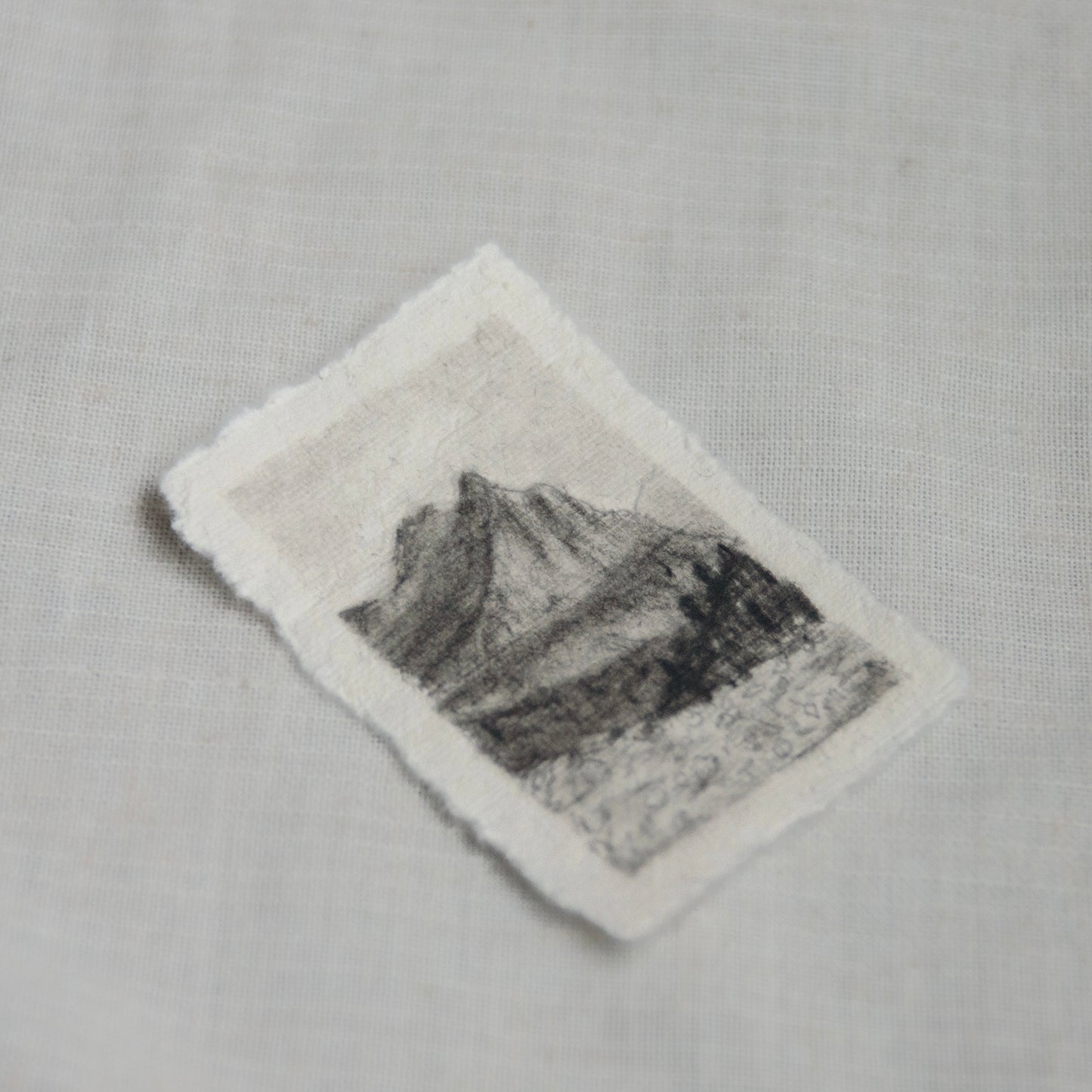 side view of a miniature sketch from Glacier National Park's going to the sun road.
