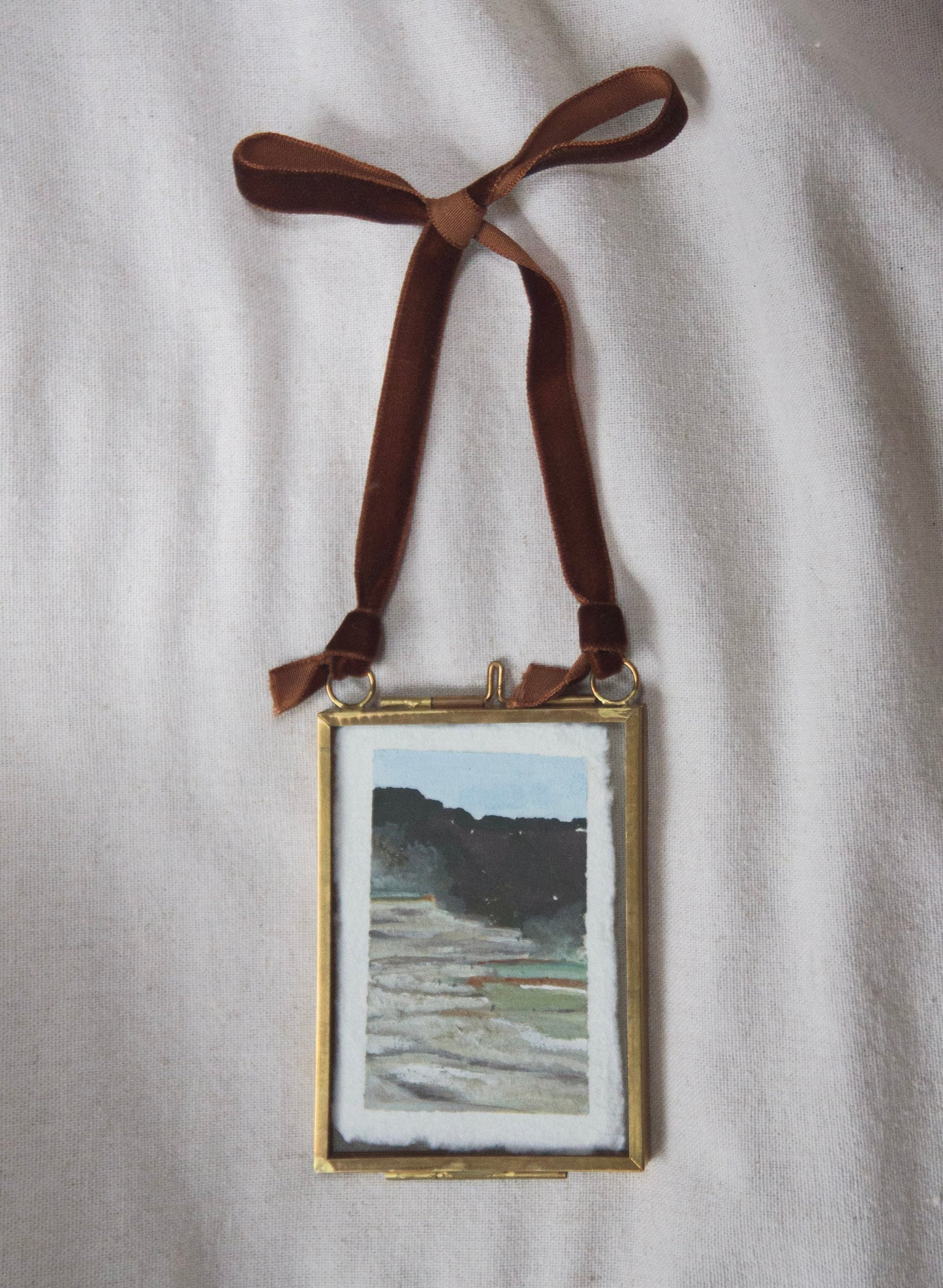 Framed Mammoth Hot Springs miniature original painting from Yellowstone National Park with a brown ribbon