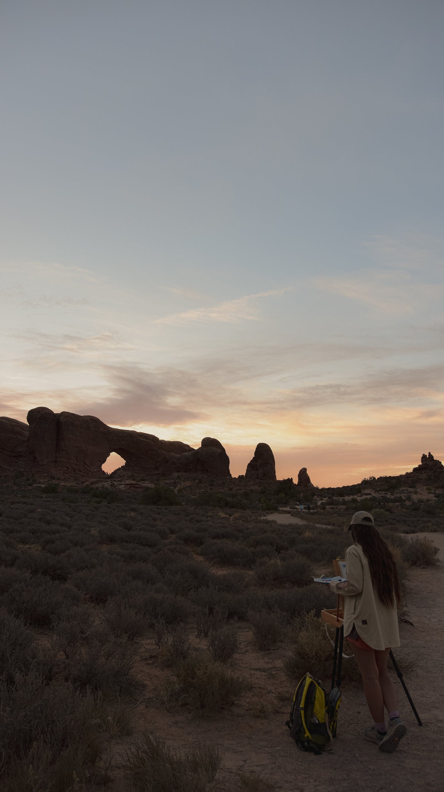 national park artist Laura van Moorleghem painting the north window arch in arches national park