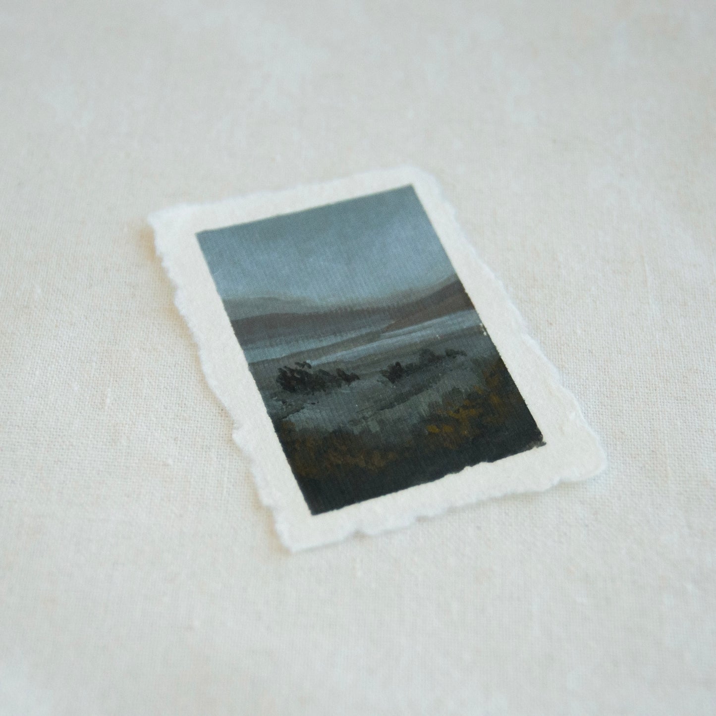 Side profile of lake and mountains in Point Reyes National Seashore painting on deckled edge 100% cotton rag paper