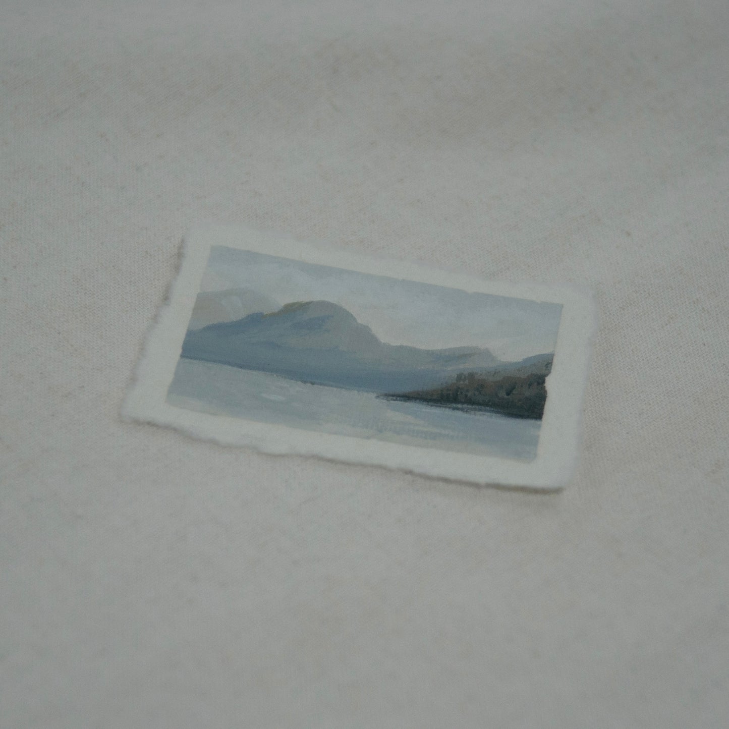 Side profile of Lake McDonald in Glacier National Park painting on deckled edge 100% cotton rag paper