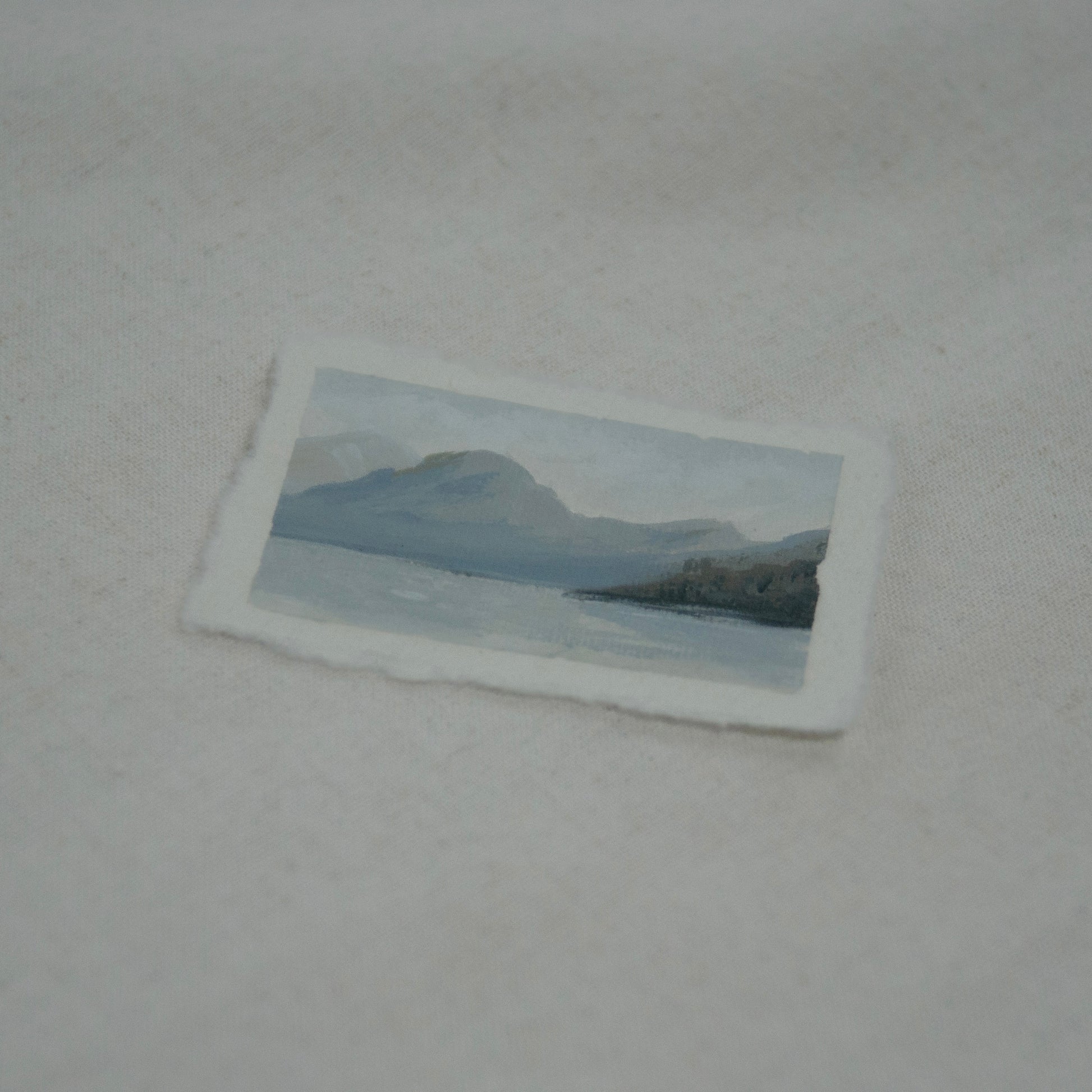 Side profile of Lake McDonald in Glacier National Park painting on deckled edge 100% cotton rag paper