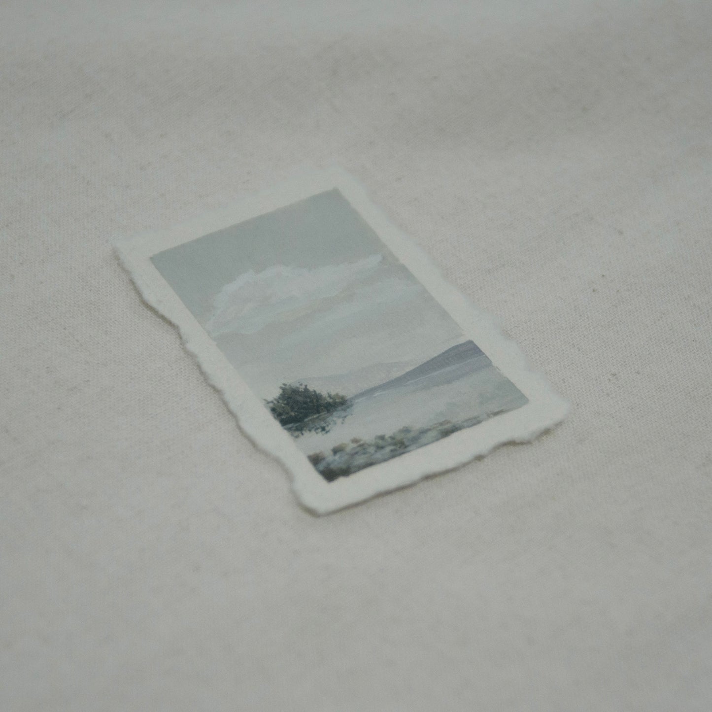 Side profile of Lake McDonald from Glacier National Park painting on deckled edge 100% cotton rag paper