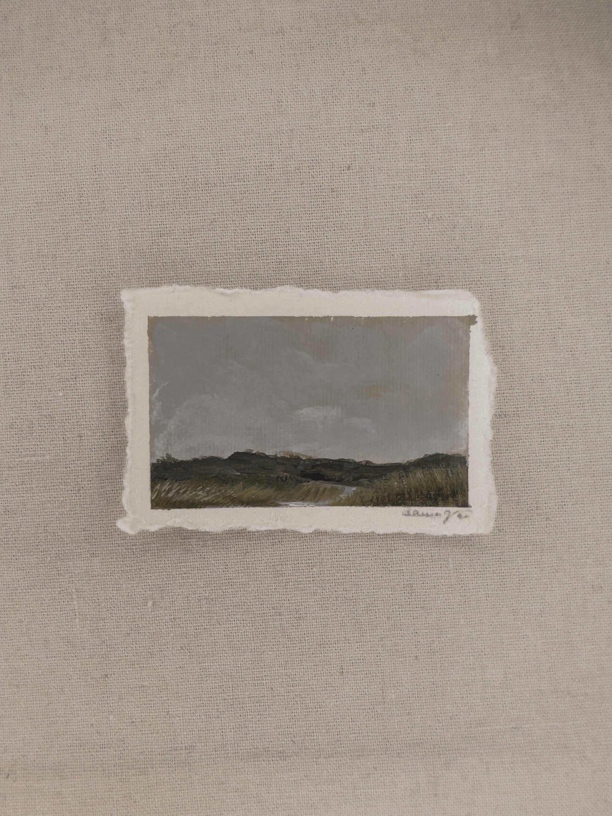 A miniature landscape painting with a cloudy sky and river part of The Journey Collection by Laura Van Moorleghem