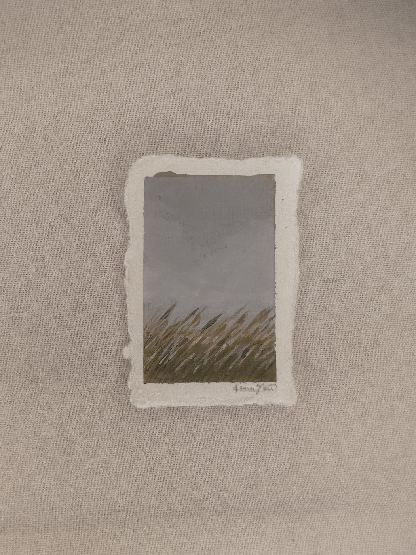 A small plein air painting of grassland  in Nebraska, painted on deckled edge paper with varnish applied to preserve the artwork.