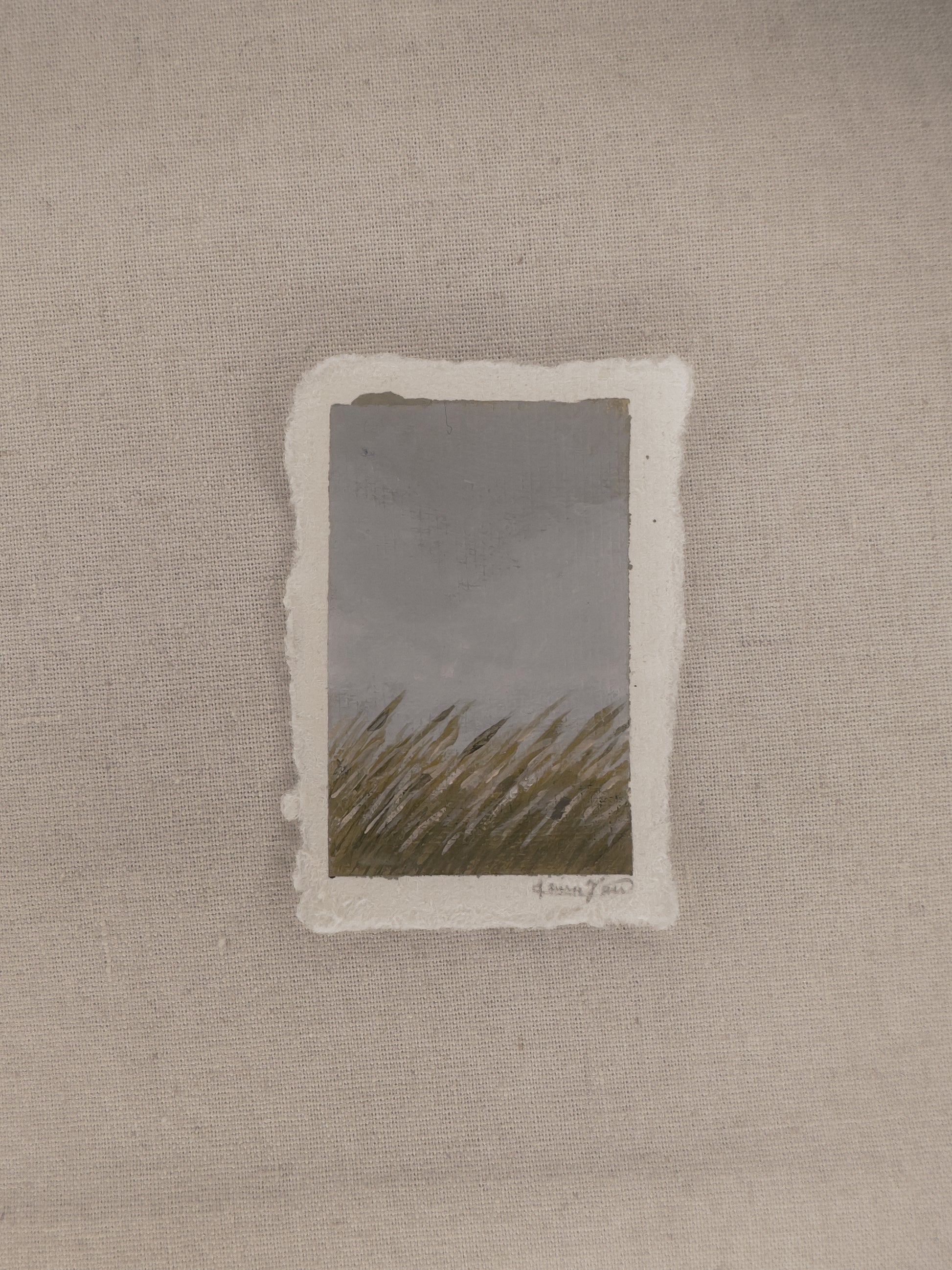 A small plein air painting of grassland  in Nebraska, painted on deckled edge paper with varnish applied to preserve the artwork.