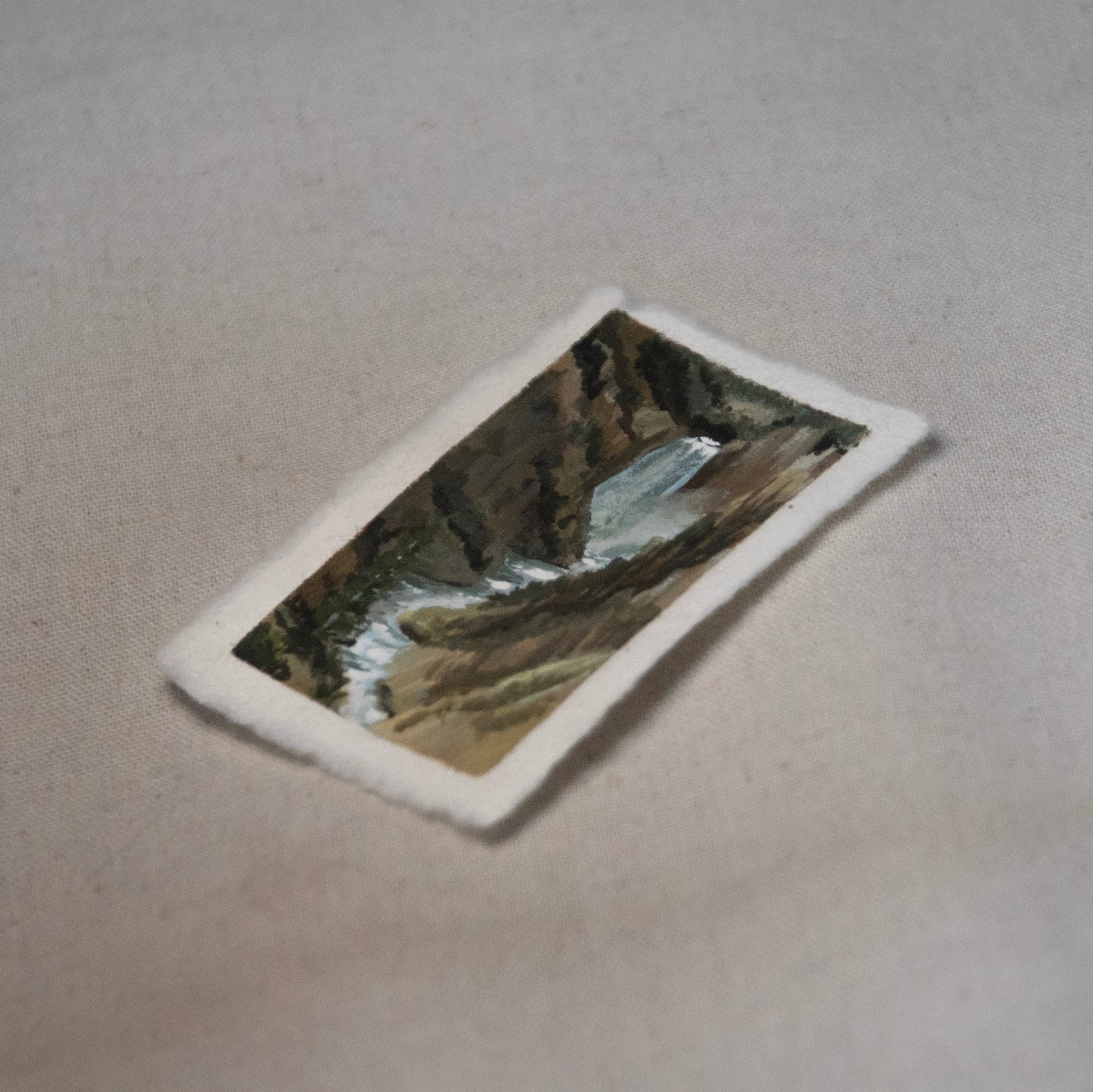 Handheld miniature painting of Yellowstone created en plein air at the park.