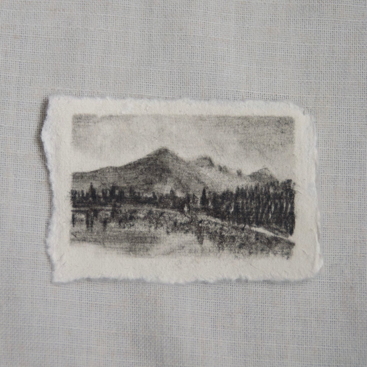 a miniature charcoal sketch of bear lake in Rocky Mountain National Park by artist Laura Van Moorleghem with 100% of the proceeds donated to NPCA