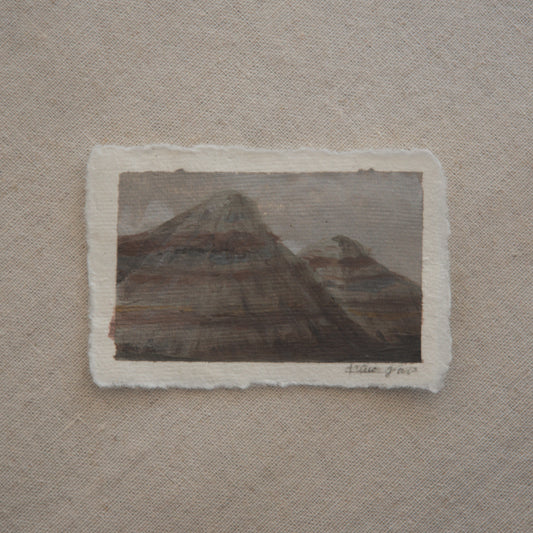 Blue Mesa mountains in a miniature acrylic painting from Petrified Forest National Park by Laura Van Moorleghem