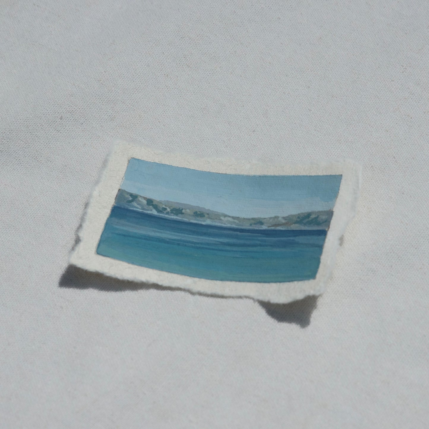 Side profile of crater lake at an overlook in Crater Lake National Park painting on deckled edge 100% cotton rag paper