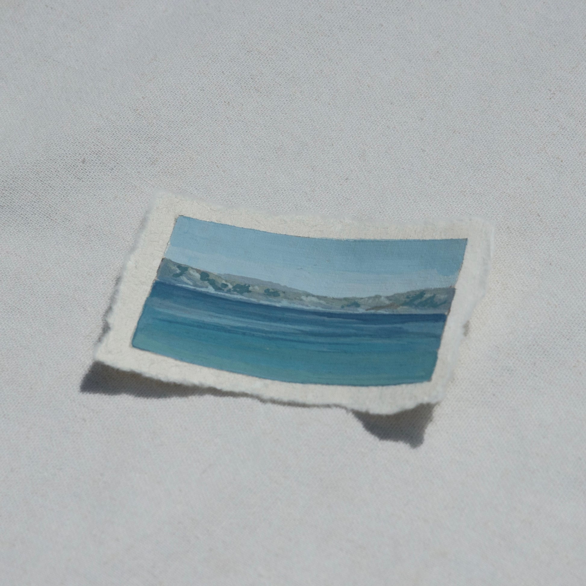 Side profile of crater lake at an overlook in Crater Lake National Park painting on deckled edge 100% cotton rag paper