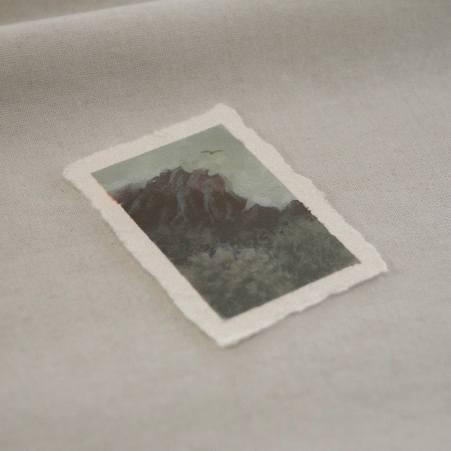 Side profile of pinnacles and a california condor painting on deckled edge 100% cotton rag paper