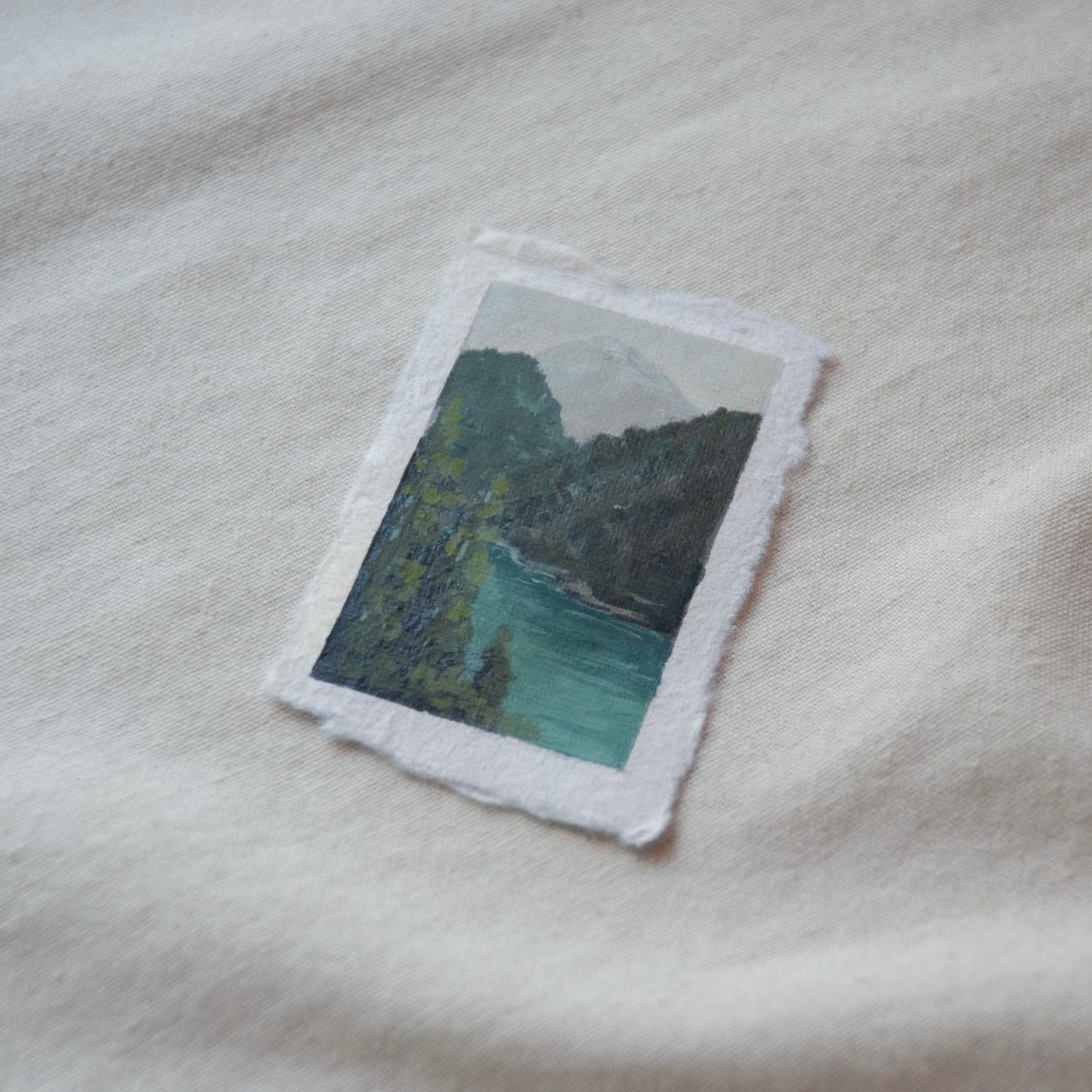 Side profile of cascade mountains and diablo lake in North Cascades National Park painting on deckled edge 100% cotton rag paper