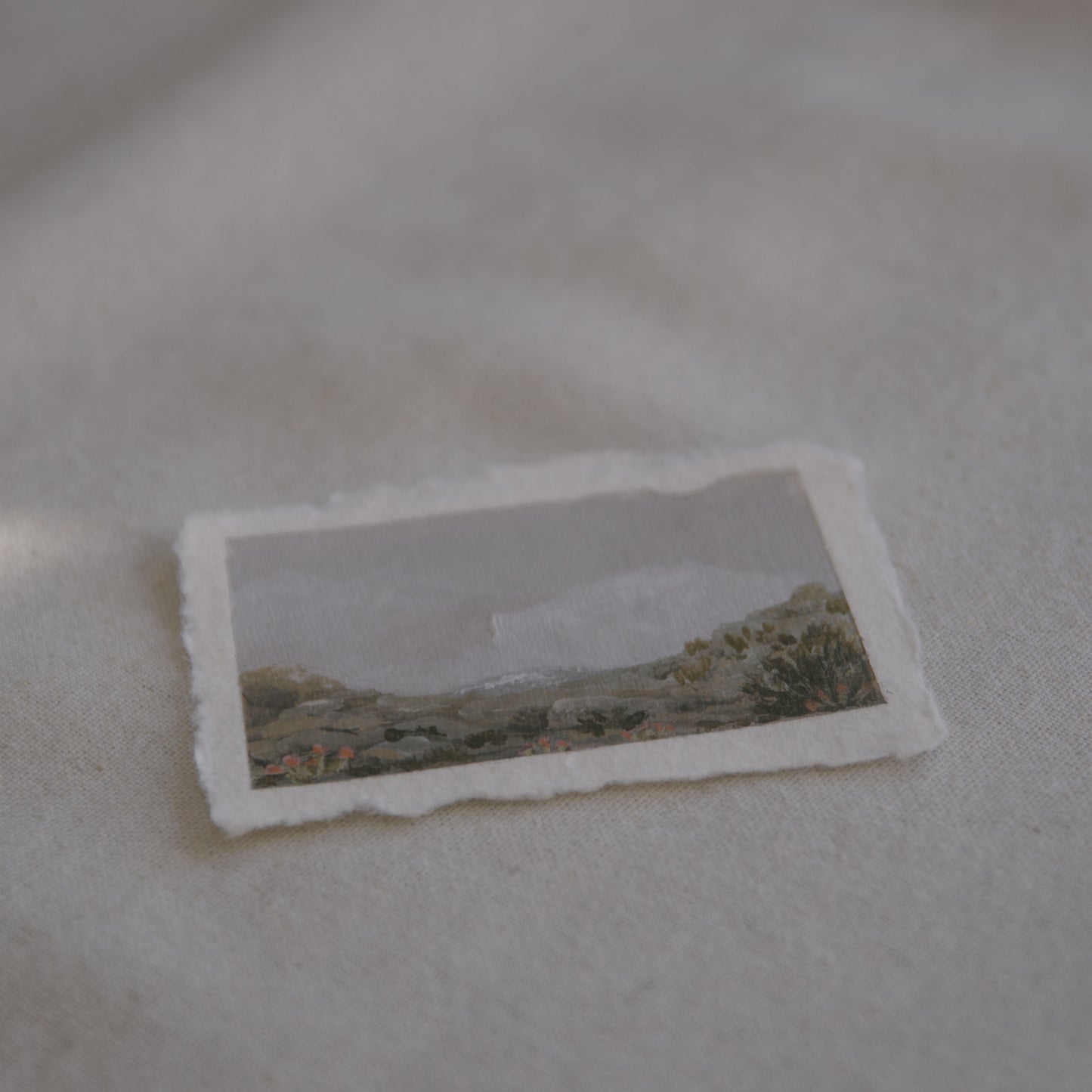 Side profile of mountains, granite boulders, and cactus from cholla cactus garden in Joshua Tree National Park painting on deckled edge 100% cotton rag paper