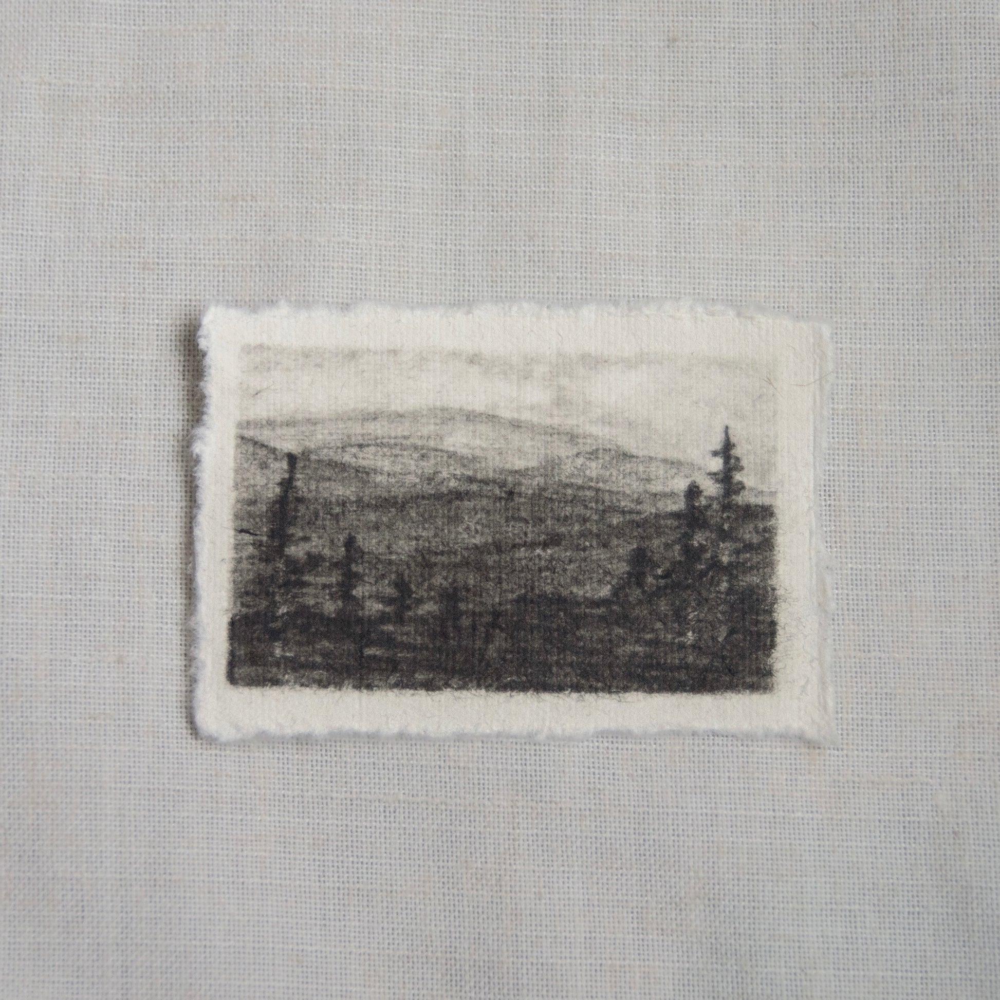 A charcoal sketch of Clingman's Dome view in Great Smoky Mountains National Park, with visible texture by artist Laura Van Moorleghem