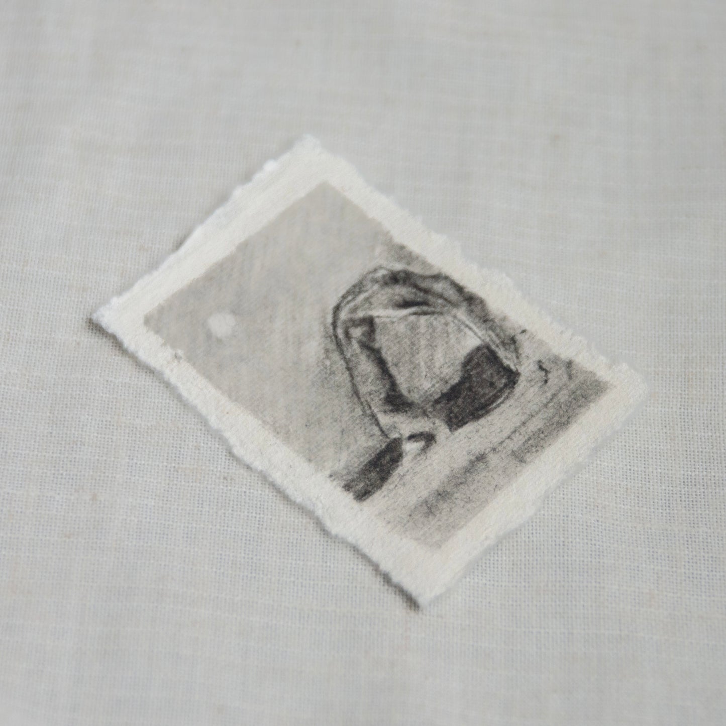 side view of miniature charcoal sketch of Delicate Arch in the moonlight for 'for the land' collection