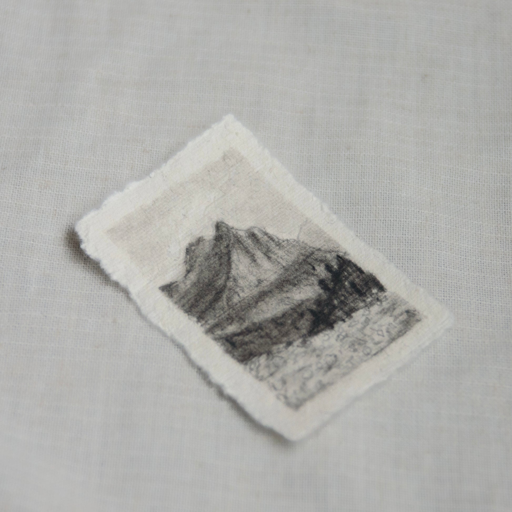 side view of a miniature sketch from Glacier National Park's going to the sun road.
