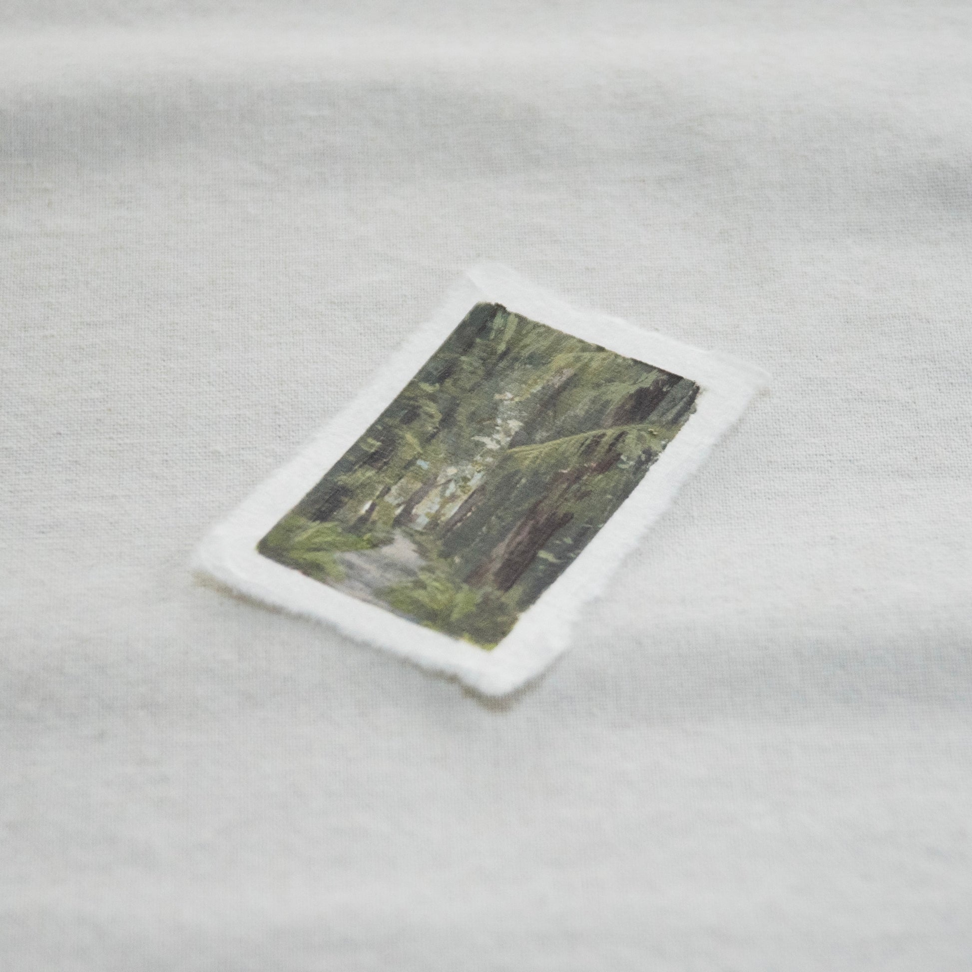 Side profile of Hoh rainforest trail painting on deckled edge 100% cotton rag paper