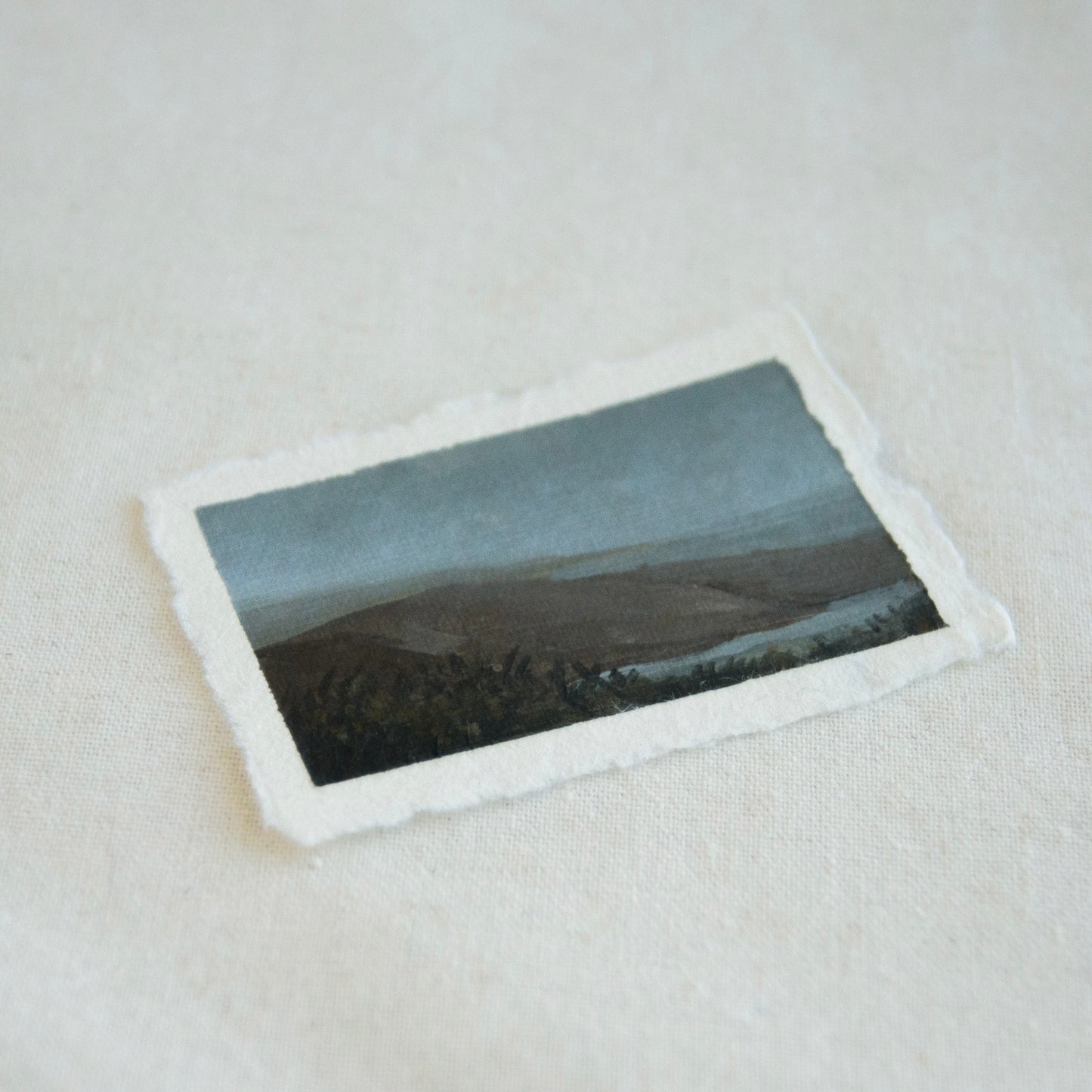 Side profile of mountain and lake at Point Reyes National Seashore painting on deckled edge 100% cotton rag paper