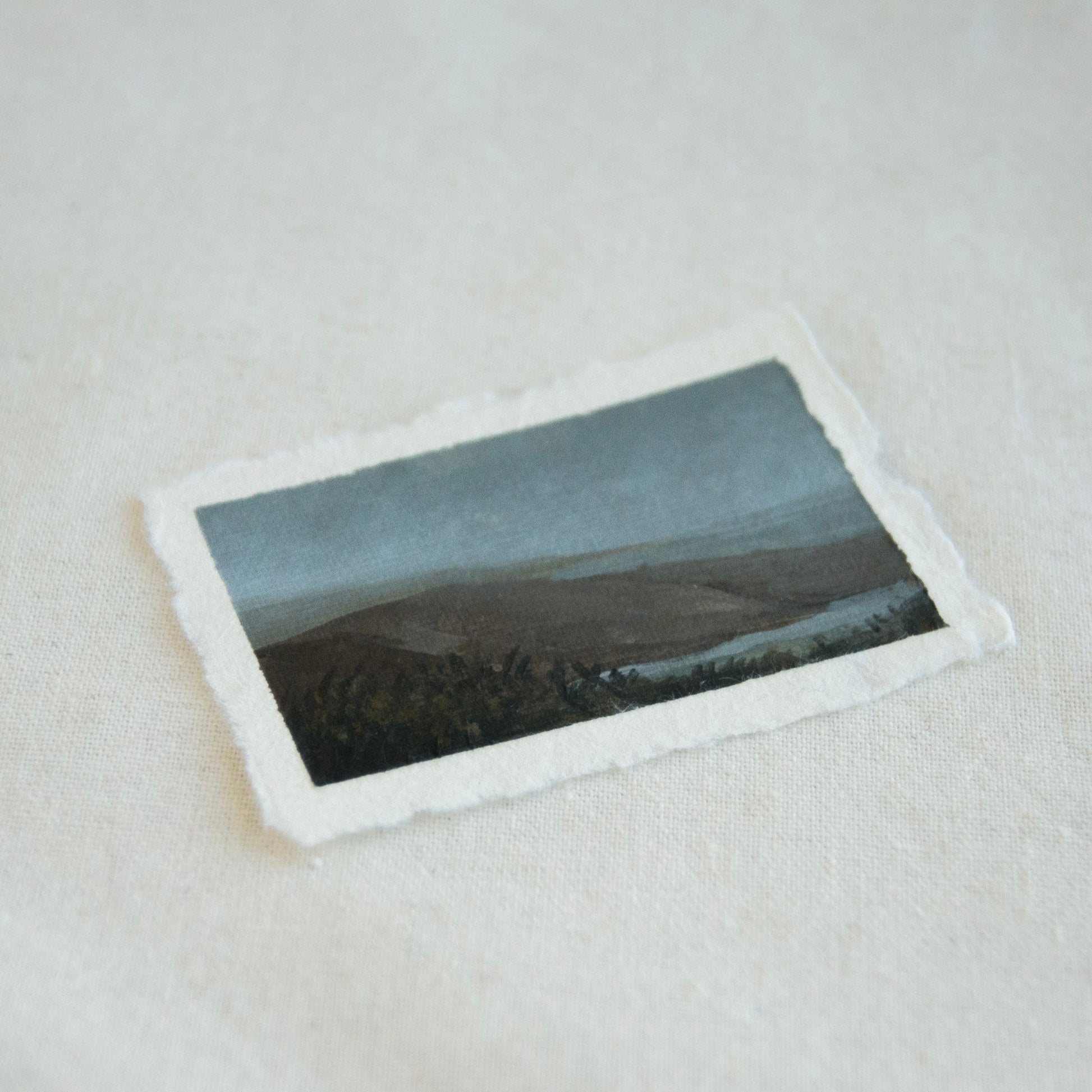 Side profile of mountain and lake at Point Reyes National Seashore painting on deckled edge 100% cotton rag paper