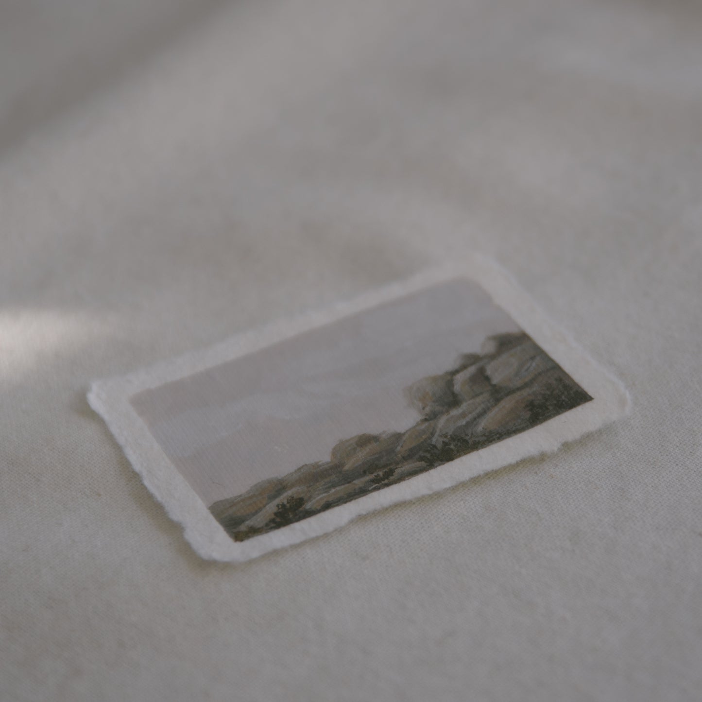 Side profile of granite boulders in joshua tree national park painting on deckled edge 100% cotton rag paper