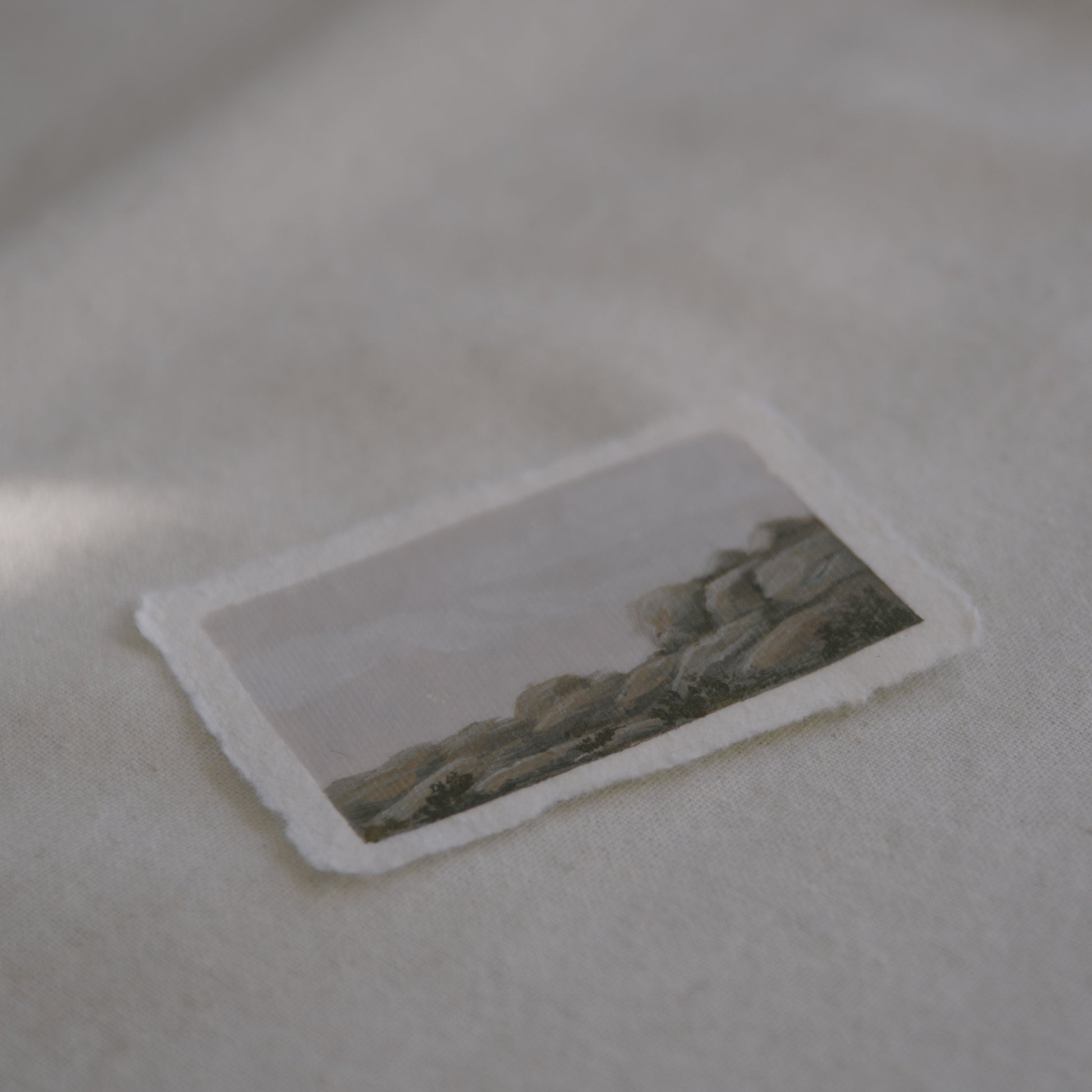 Side profile of granite boulders in joshua tree national park painting on deckled edge 100% cotton rag paper