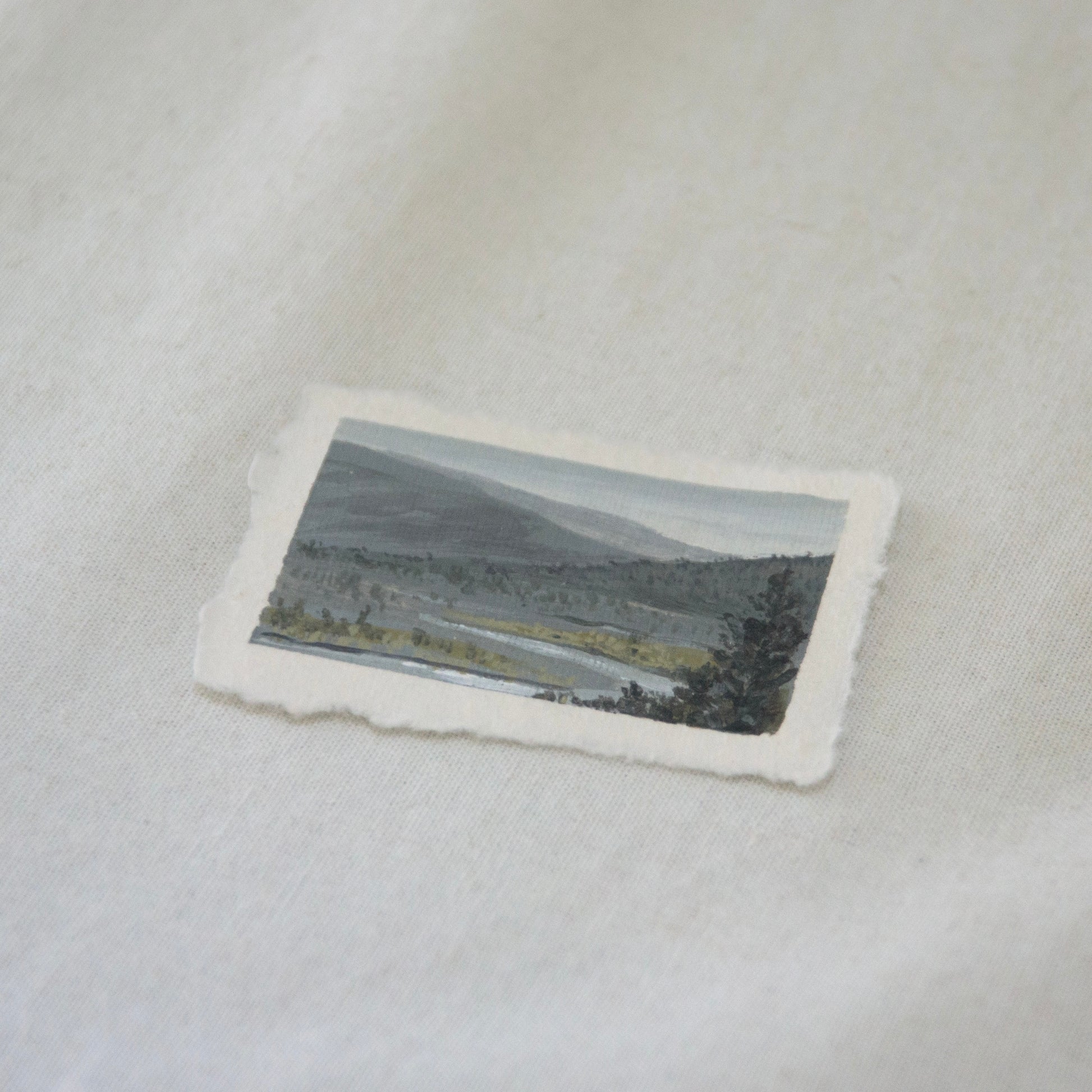 Side profile of overlook at Lassen Volcanic National Park of river and mountains mini painting on deckled edge 100% cotton rag paper