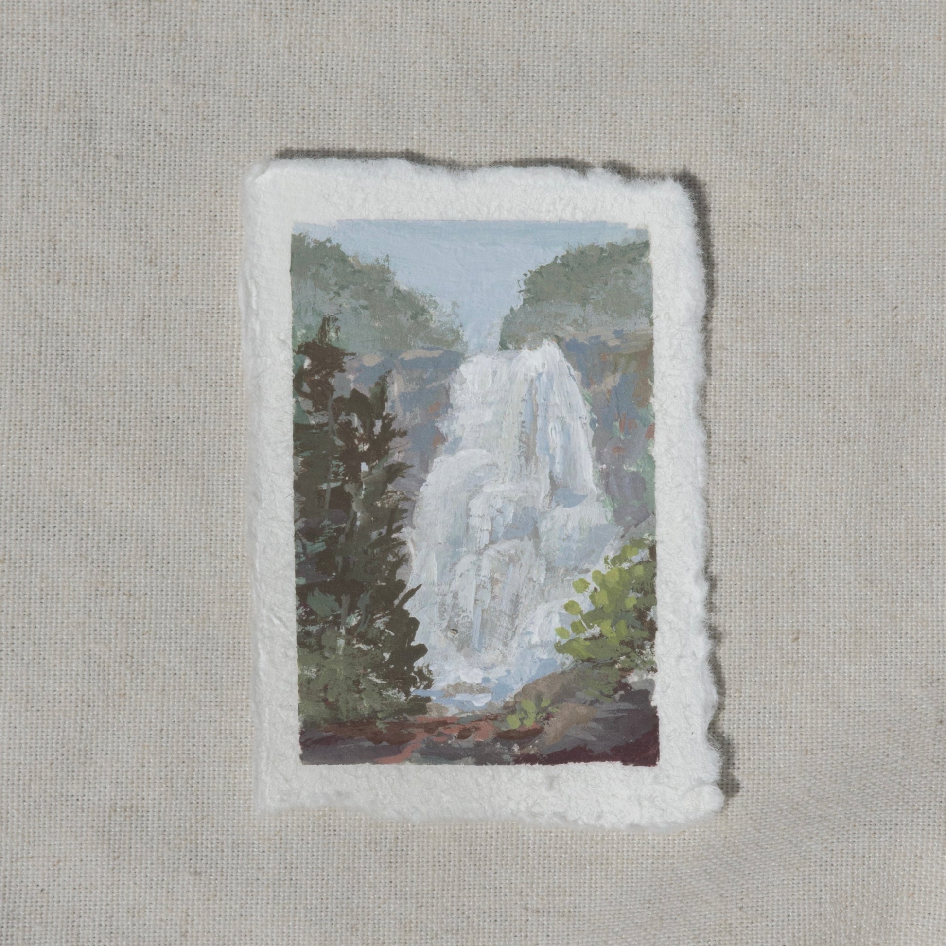 A miniature gouache painting of Grizzly Falls waterfall from Kings Canyon National Park surrounded by greenery on 100% cotton rag by Laura Van Moorleghem