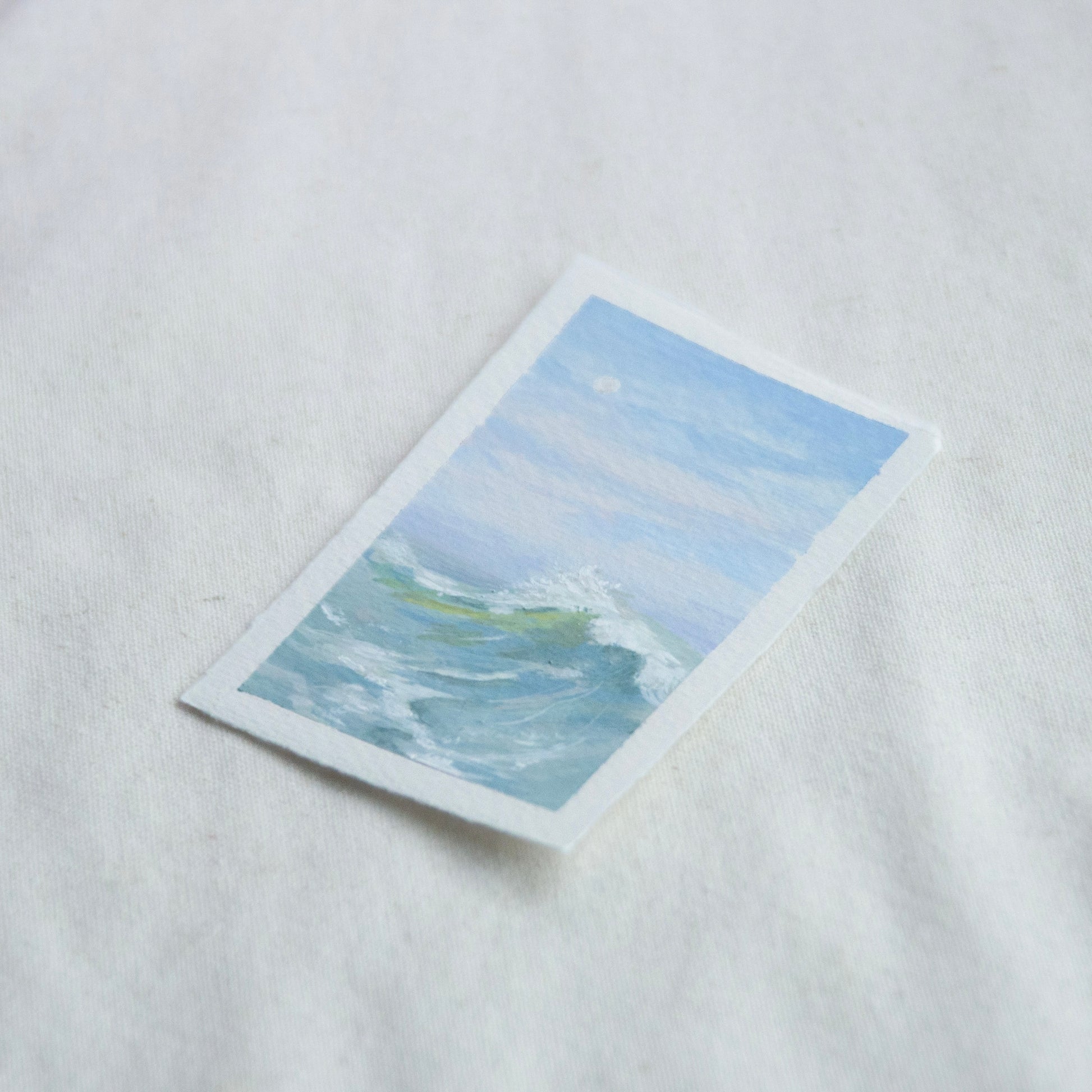 Side profile of large wave in gulf islands national seashore painting on deckled edge 100% cotton rag paper