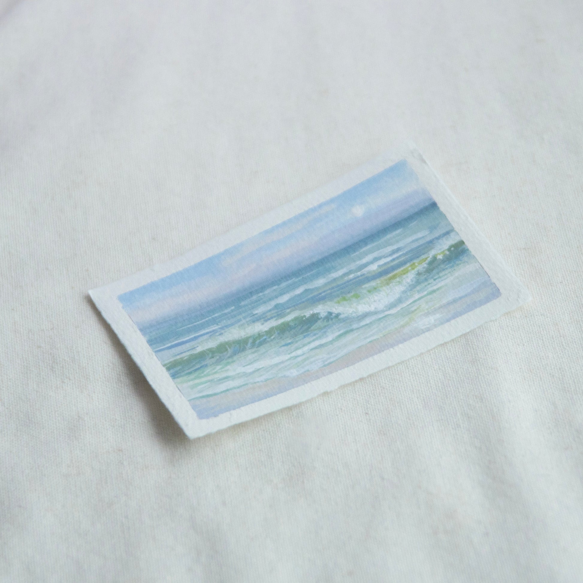 Side profile of large wave in gulf islands national seashore painting on deckled edge 100% cotton rag paper