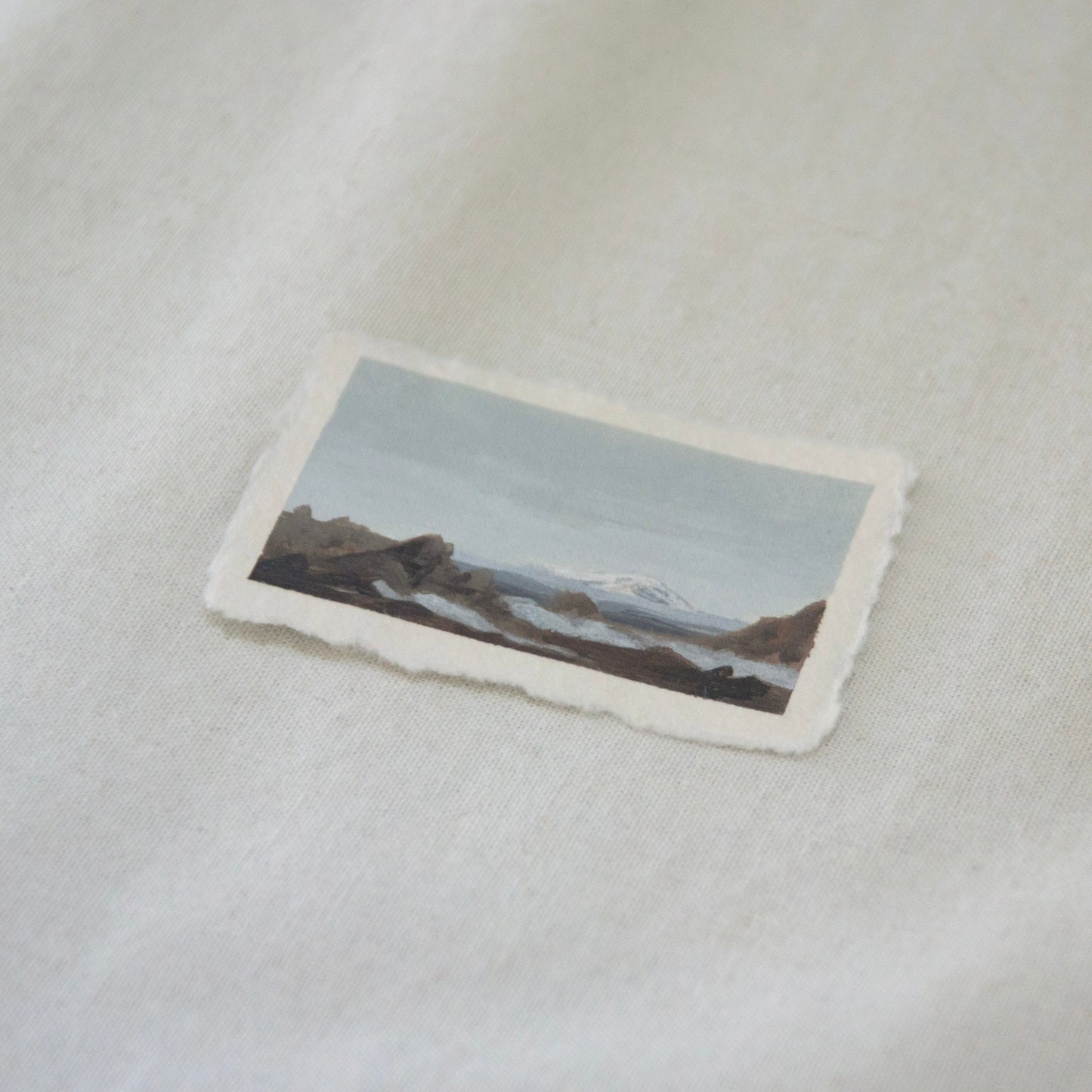 Side profile of Mount Shasta from peak of Lassen Volcano painting on deckled edge 100% cotton rag paper from Lassen Volcanic National Park