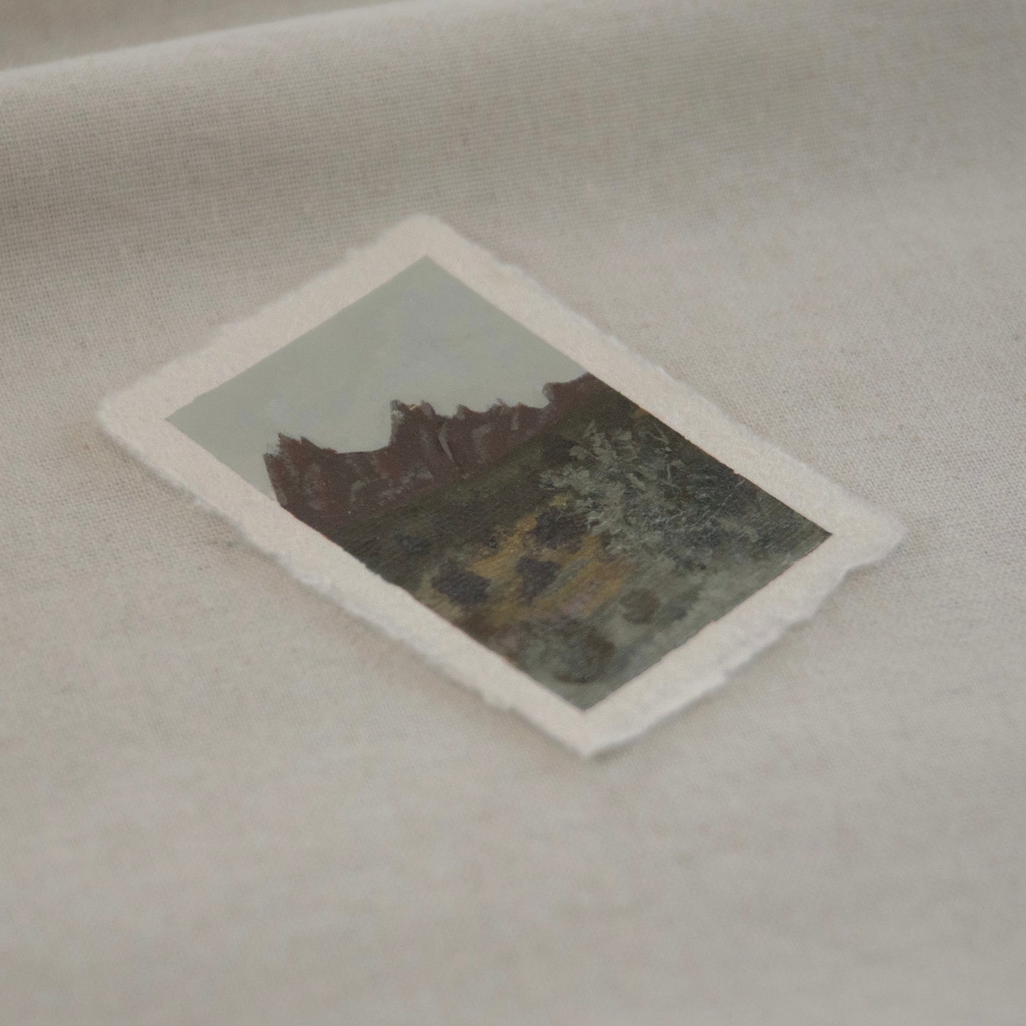 Side profile of pinnacles with yellow and light green brushstrokes miniature acrylic painting on deckled edge 100% cotton rag paper