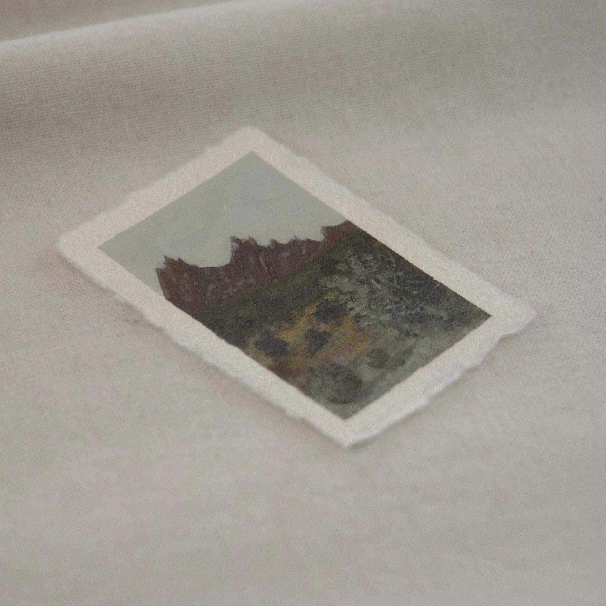 Side profile of pinnacles with yellow and light green brushstrokes miniature acrylic painting on deckled edge 100% cotton rag paper