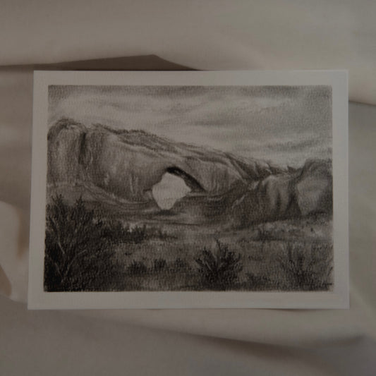 A charcoal and pencil drawing of a landscape, North Window study, with a view of a large rock formation by artist Laura van Moorleghem