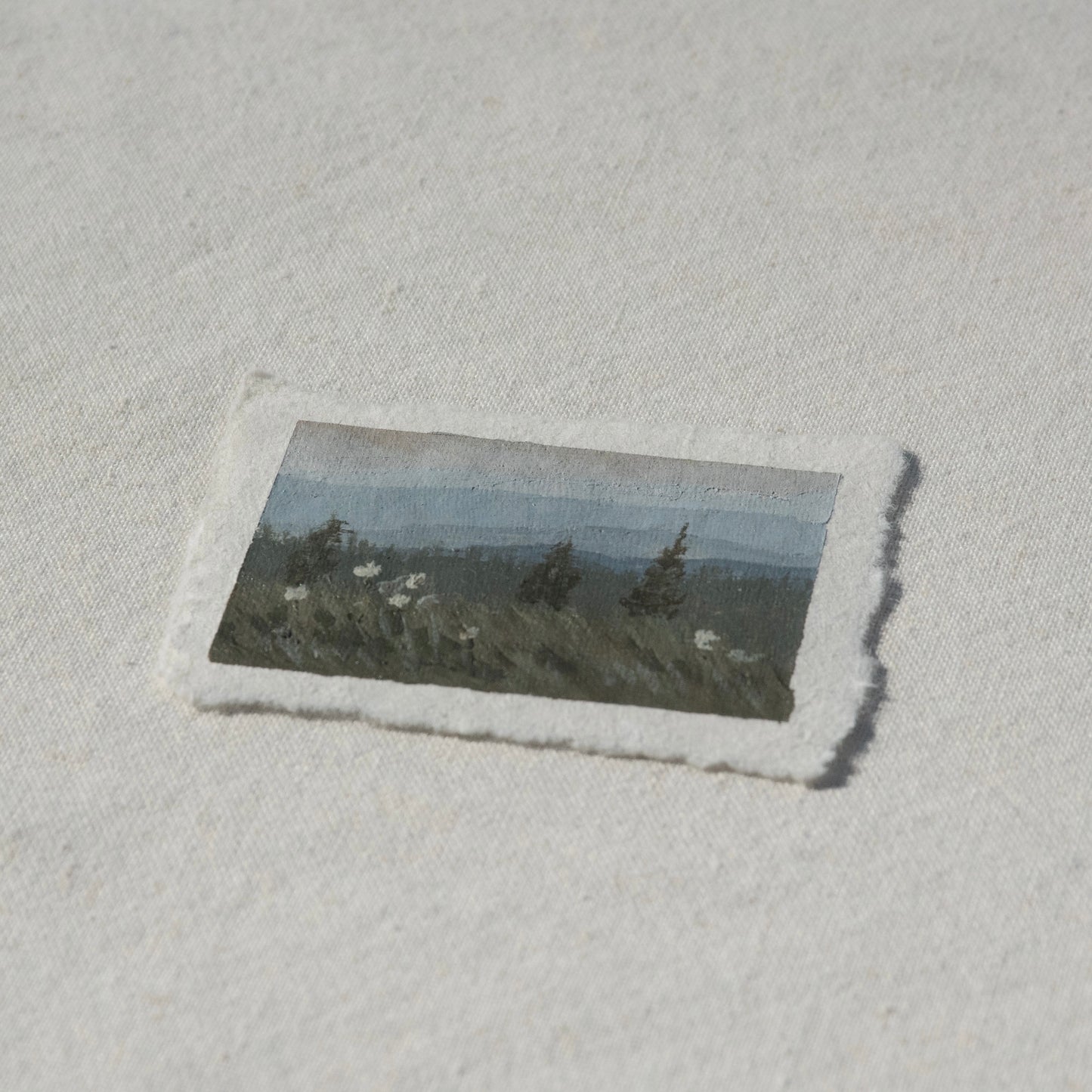 Side profile of beargrass and mountains in mount rainier national park painting on deckled edge 100% cotton rag paper