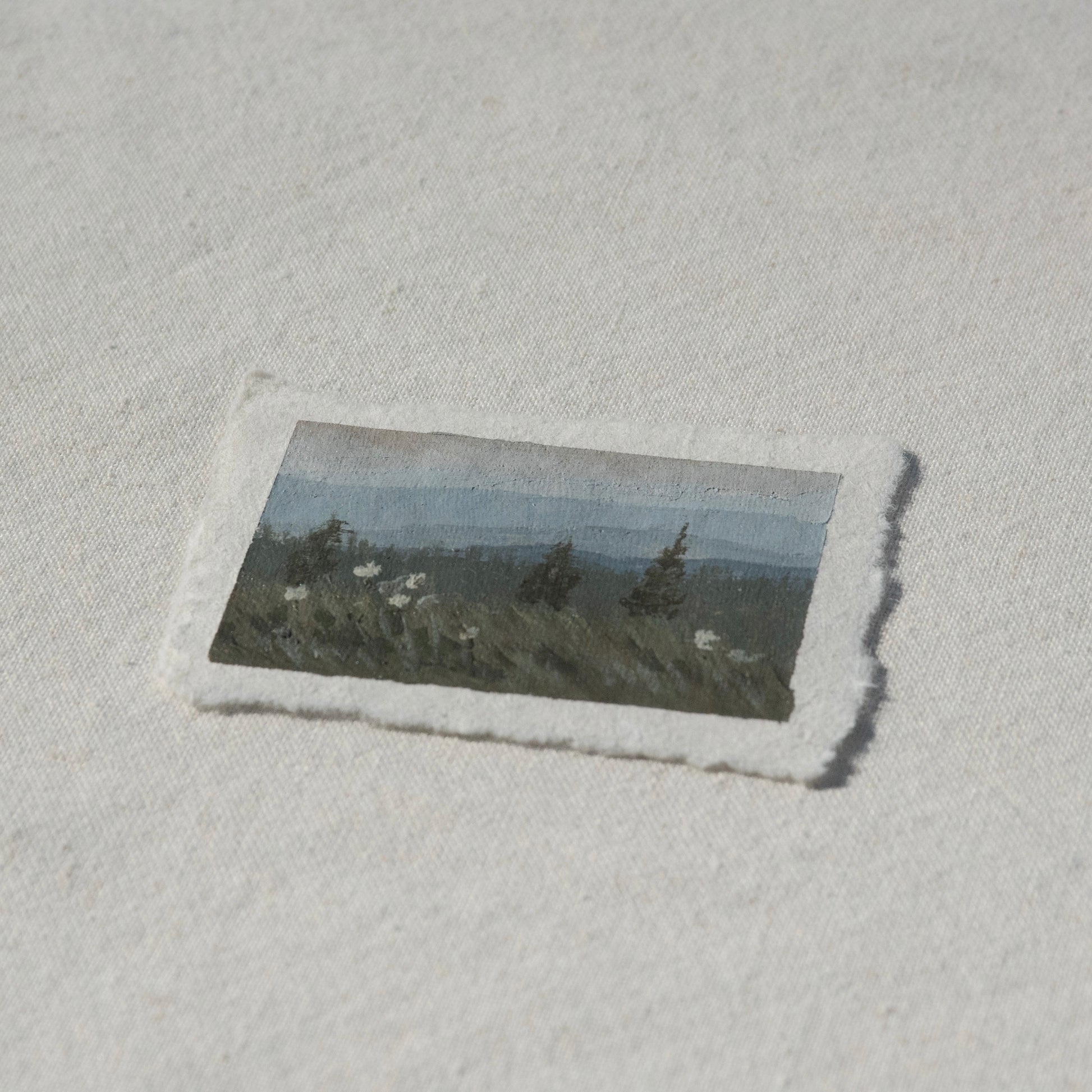 Side profile of beargrass and mountains in mount rainier national park painting on deckled edge 100% cotton rag paper