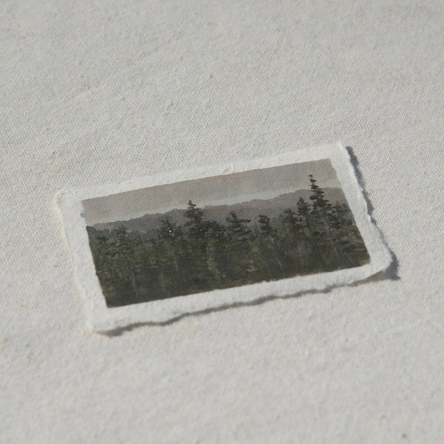 Side profile of pine trees in skyline trail in mount rainier national park painting on deckled edge 100% cotton rag paper