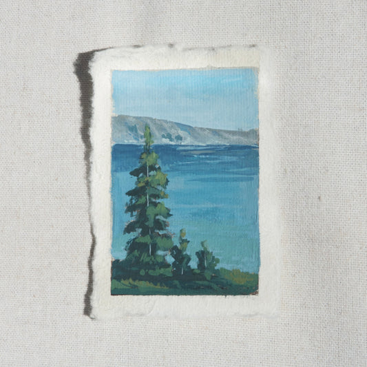 crater lake blues, mountains, and trees small gouache painting by Laura Van Moorleghem from Crater Lake National Park