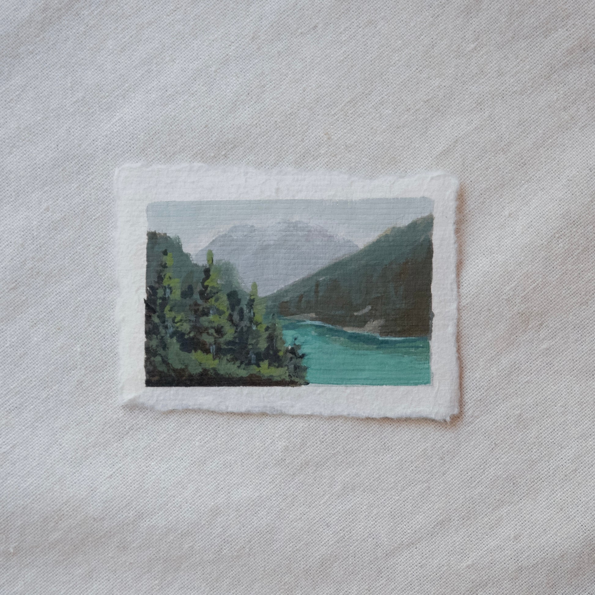 Diablo lake overlook, pine trees, and north cascade mountains miniature gouache painting from North cascades National Park by Laura Van Moorleghem