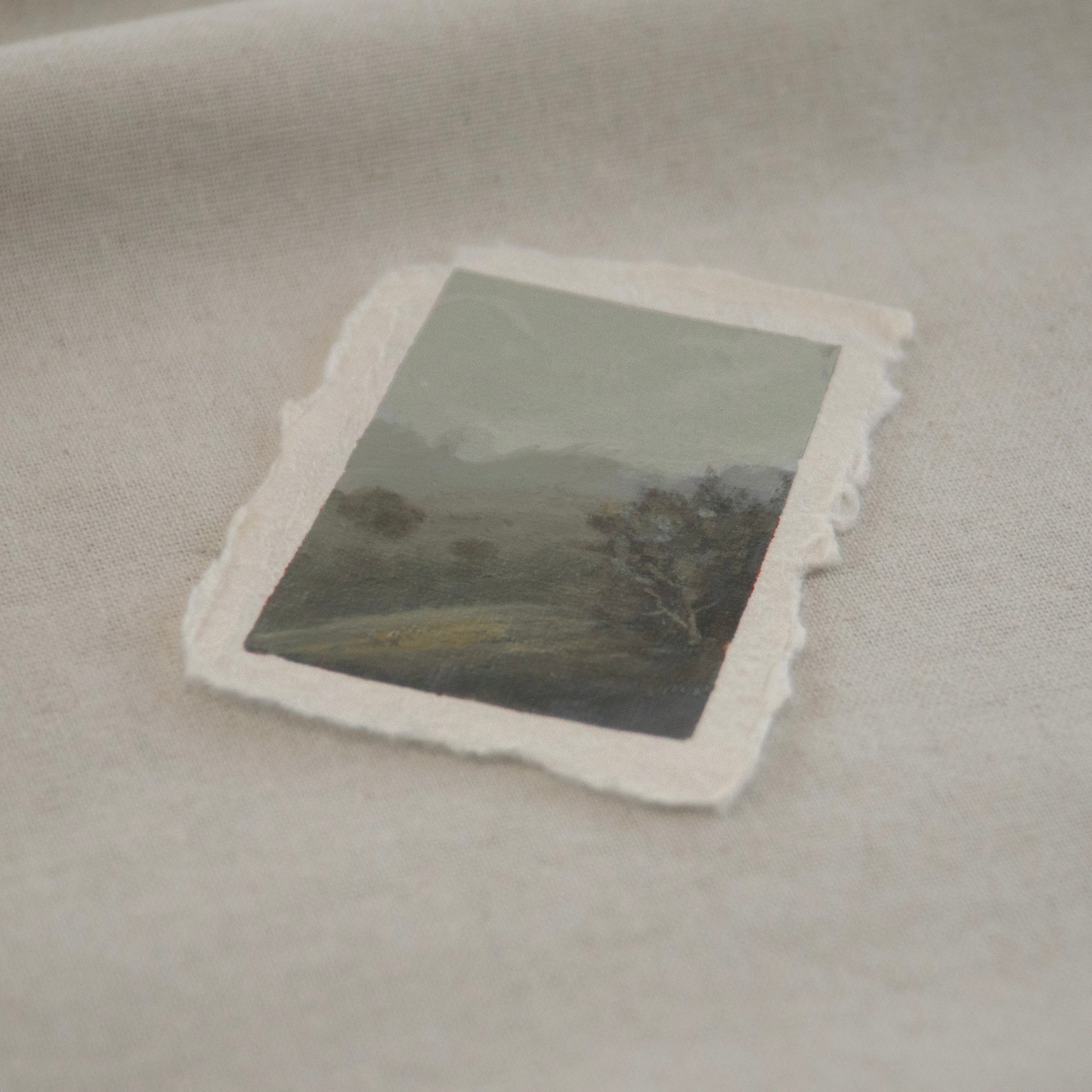 Side profile of pinnacle peaks in a foggy distance with dappled tree on a hillside miniature Pinnacles National Park painting on deckled edge 100% cotton rag paper
