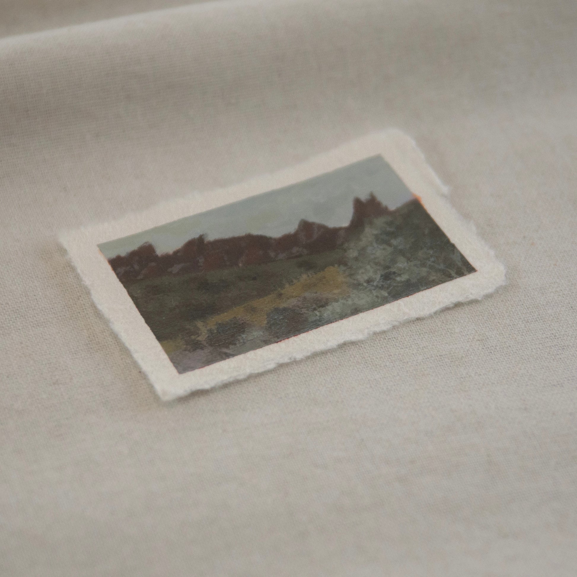 Side profile of pinnacles and hillsides of Pinnacles National Pakr miniature painting on deckled edge 100% cotton rag paper