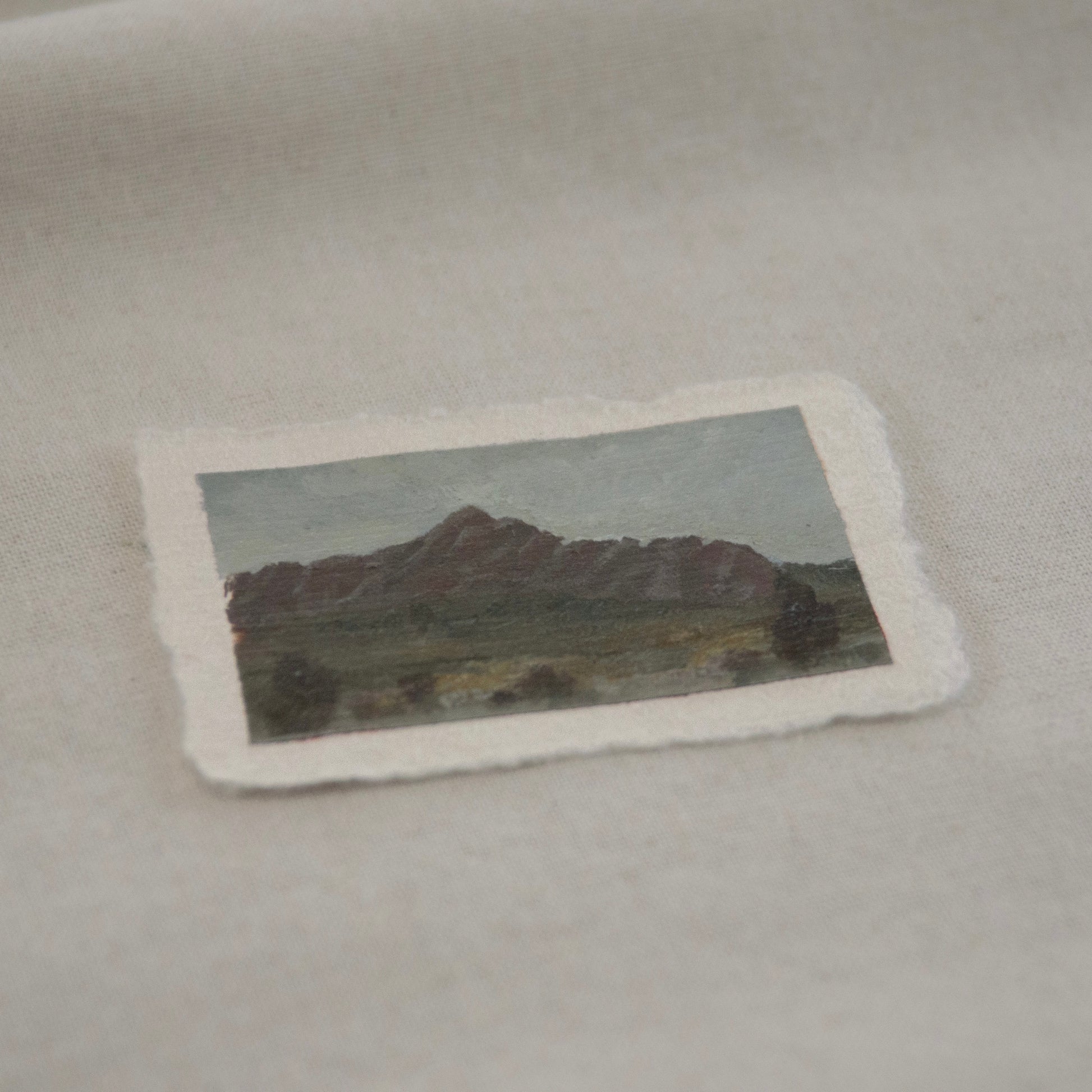 Side profile of pinnacle peaks and lush greenery acrylic painting on deckled edge 100% cotton rag paper