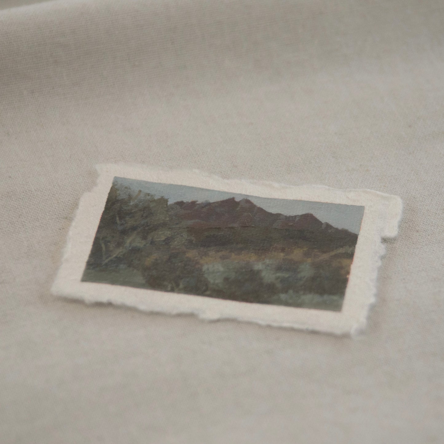 Side profile of pinnacles with lush green foreground acrylic painting on deckled edge 100% cotton rag paper