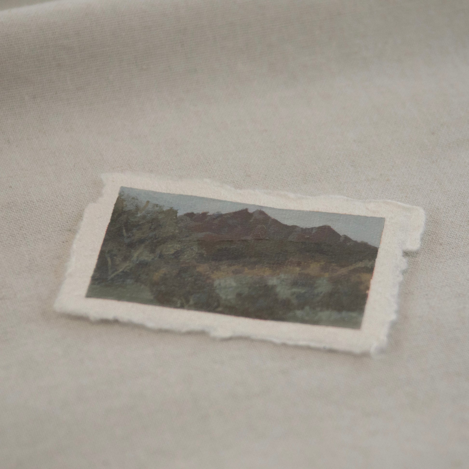 Side profile of pinnacles with lush green foreground acrylic painting on deckled edge 100% cotton rag paper