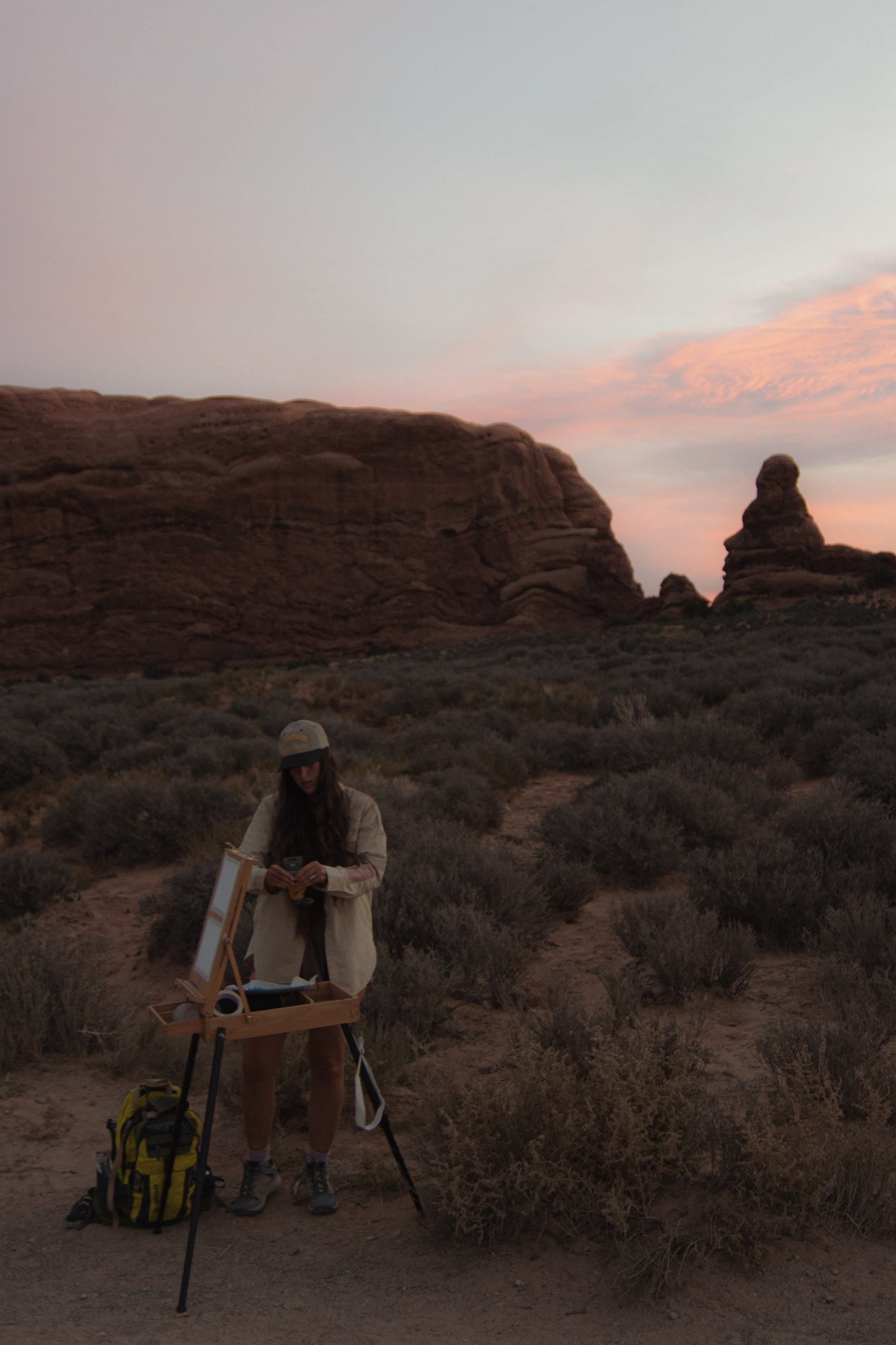 plein air artist Laura van Moorleghem painting at arches national park for the journey collection