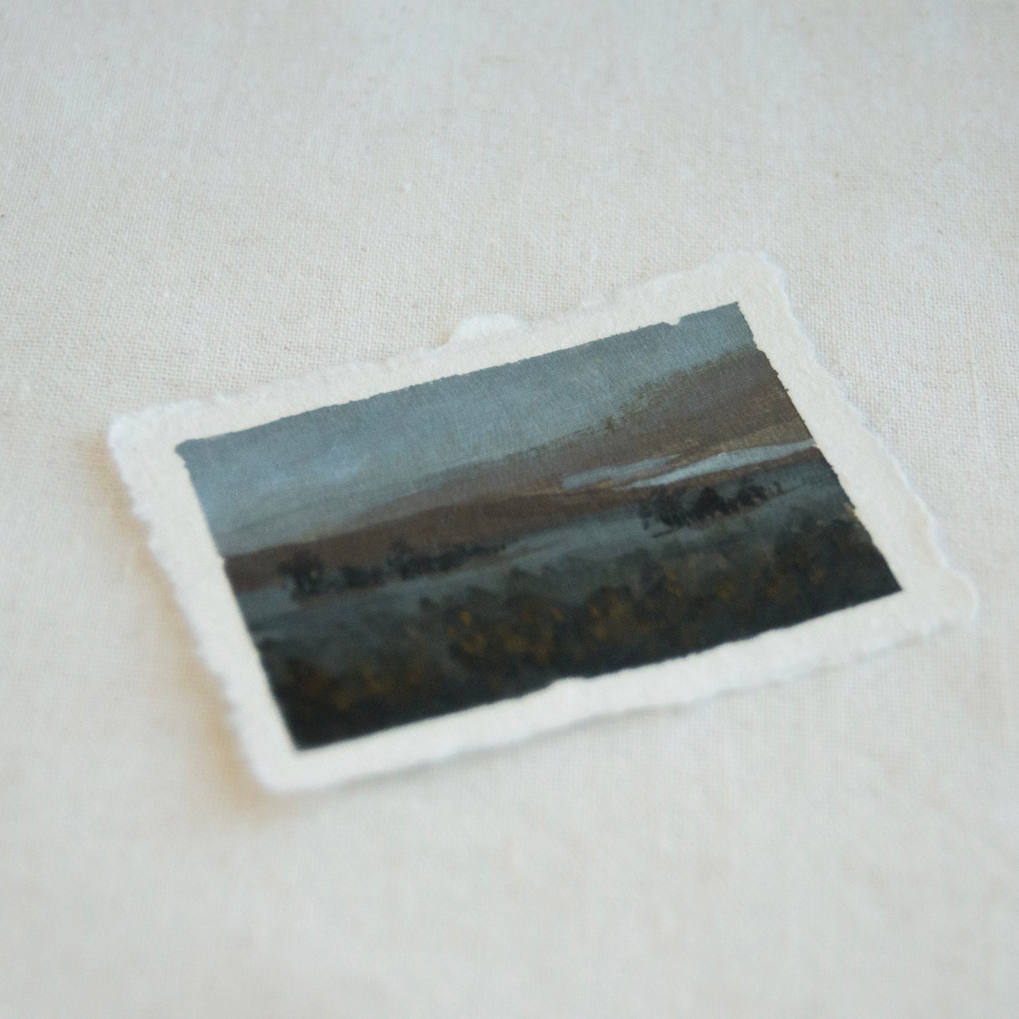 Side profile of Point Reyes overlook of reflective water and grassy foreground at Point Reyes National Seashore painting on deckled edge 100% cotton rag paper
