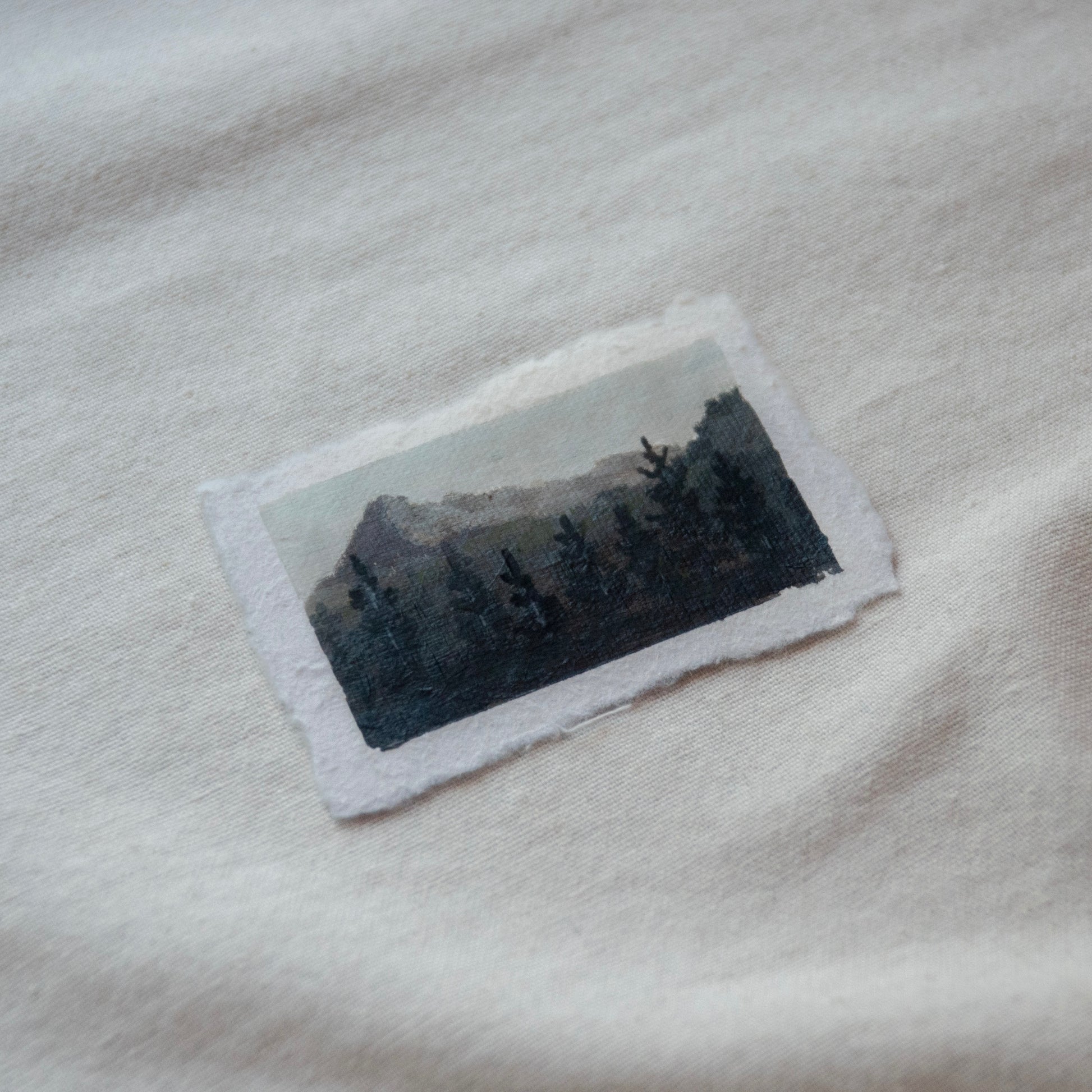 Side profile of pyramid peak in north cascades national park painting on deckled edge 100% cotton rag paper