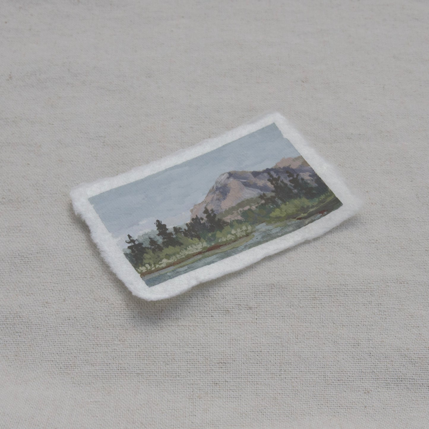 Side profile of mountain and lake painting on deckled edge 100% cotton rag paper from Kings Canyon National Park