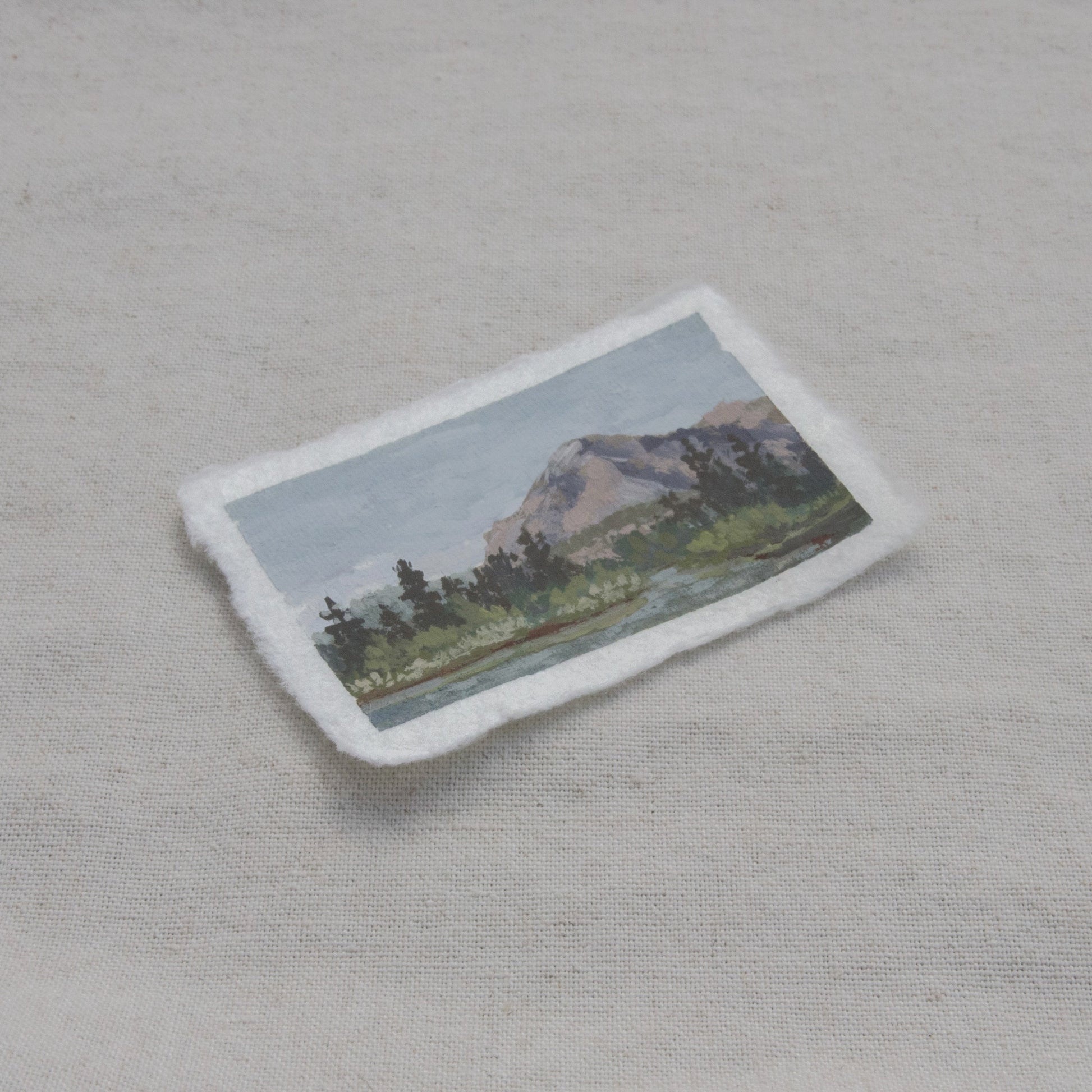 Side profile of mountain and lake painting on deckled edge 100% cotton rag paper from Kings Canyon National Park