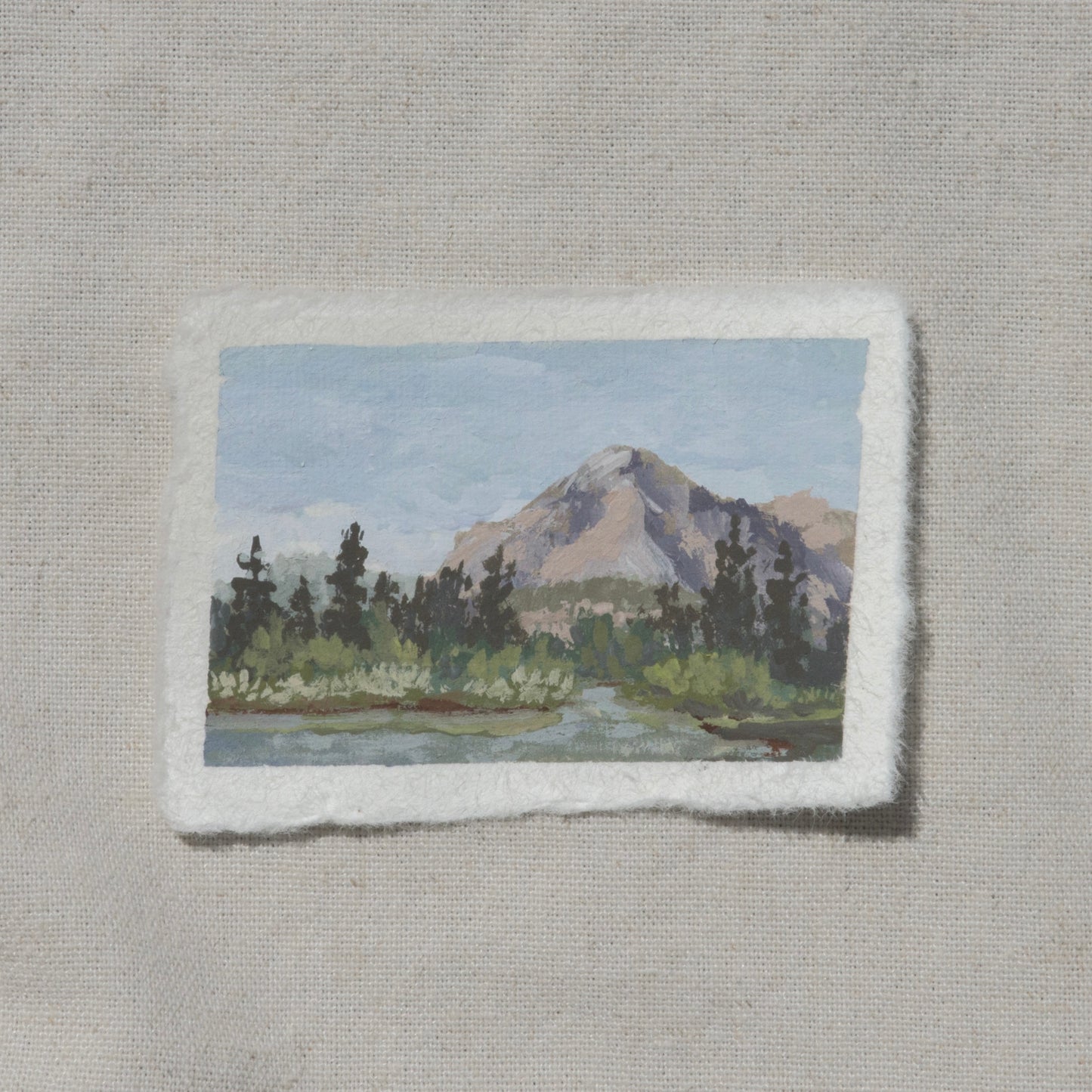A miniature gouache painting on cotton rag paper with a deckled edge, depicting a landscape with a Kings Canyon mountain and trees from Kings Canyon National Park rae lakes by Laura Van Moorleghem